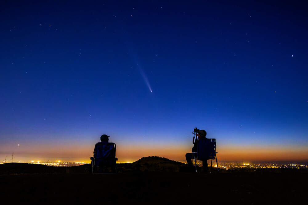 Comet Tsuchinshan-Atlas makes an appearance in the western night sky as amateur photographers observe on a ridge near the Dry Creek Trailhead in Boise, Idaho. Monday, Oct. 14, 2024 (Kyle Green/AP)