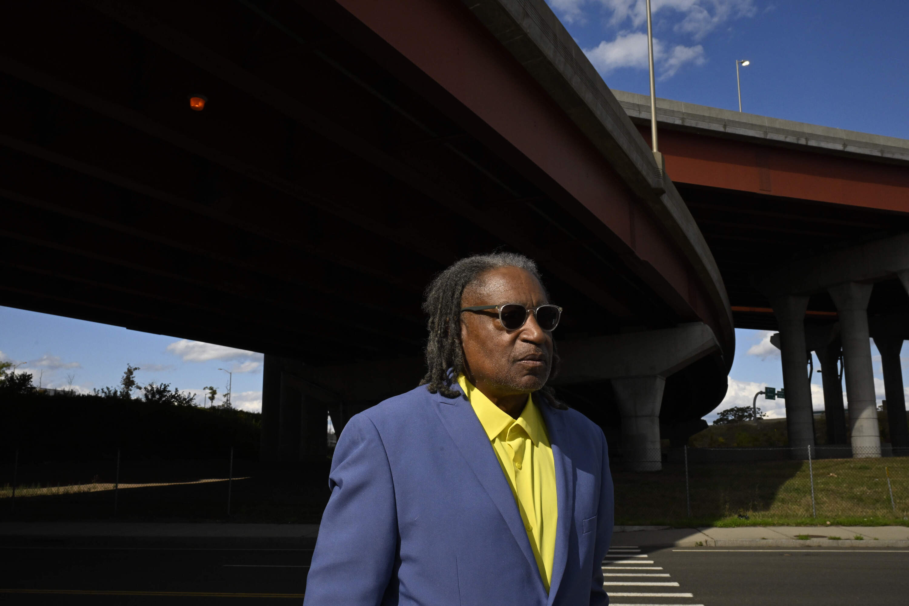 City Alder Thomas Ficklin Jr., who died suddenly at his home on Oct. 9 at the age of 75, poses Wednesday, Oct. 9, 2024, where a site was proposed for the nation's first African American college back in 1831, in New Haven, Conn. (Jessica Hill/AP)