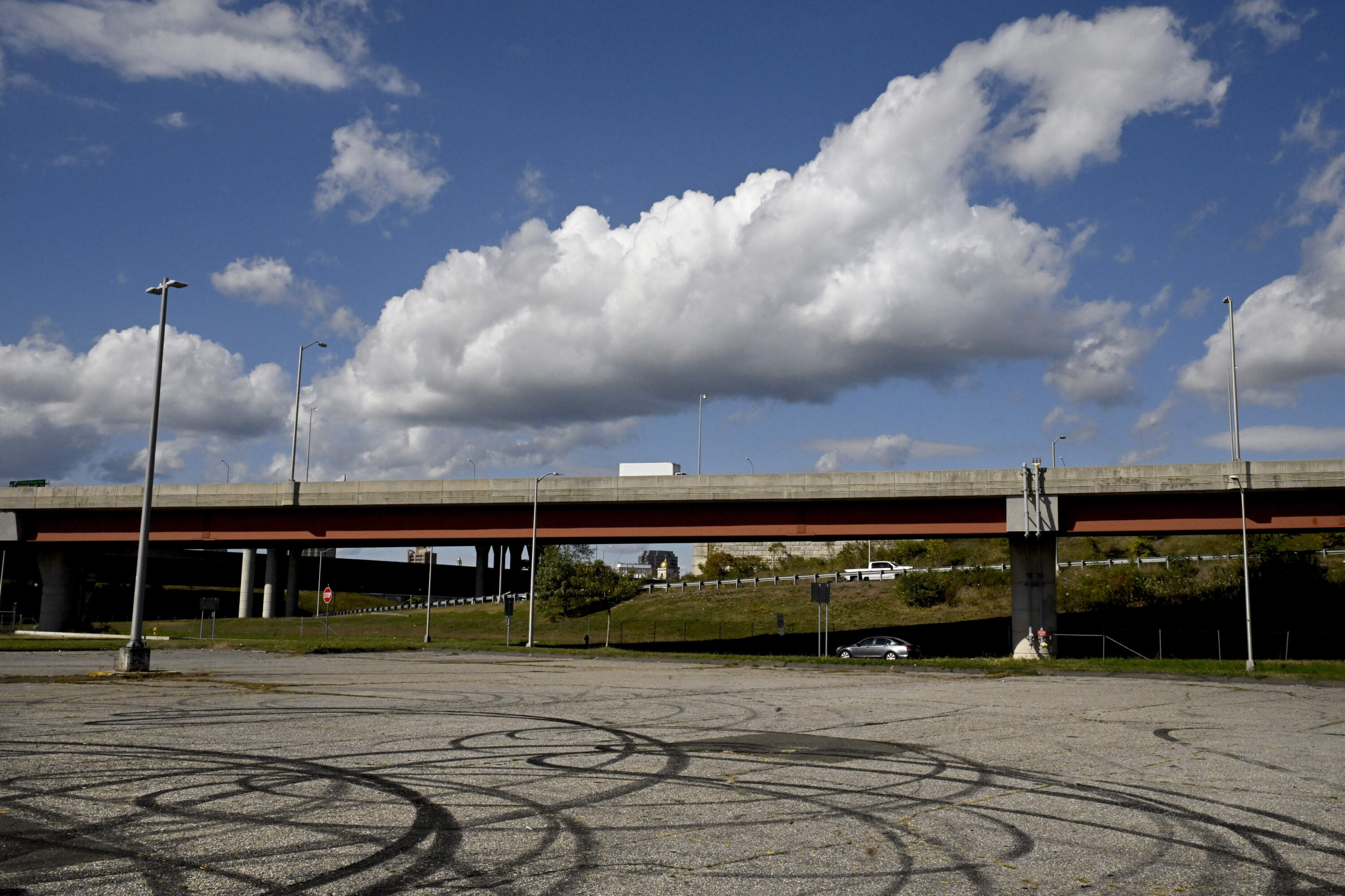 A highway overpass and empty parking lot marks the location proposed for the nation's first African American college back in 1831 in New Haven, Conn. (Jessica Hill/AP)