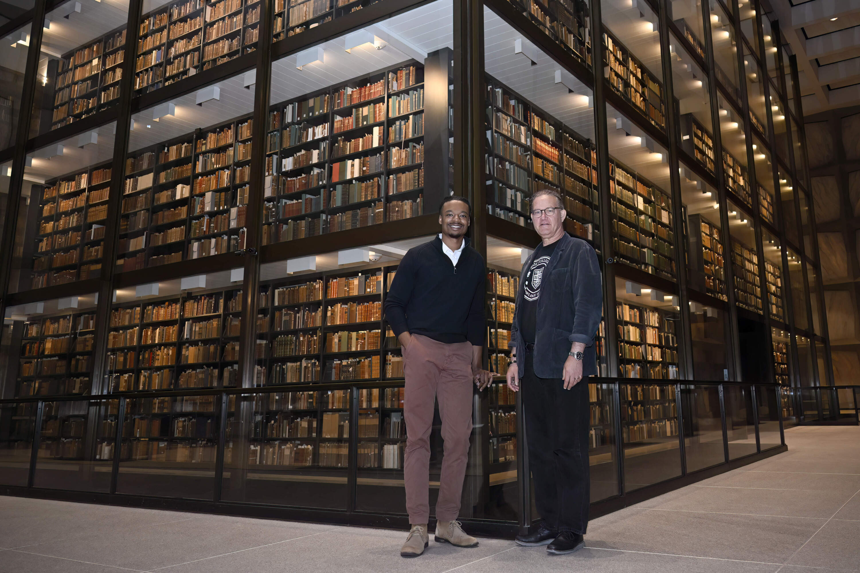 Tubyez Cropper, left, and Michael Morand, pose inside Yale's Beinecke Rare Book &amp; Manuscript Library, Wednesday, Oct. 9, 2024, in New Haven, Conn. (Jessica Hill/AP)