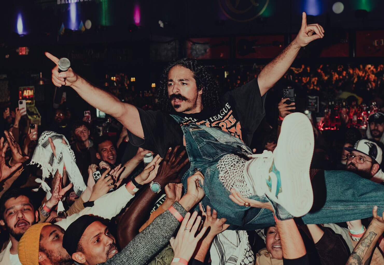 Anees crowd surfs at his concert. (Courtesy of Ryan Lockard)