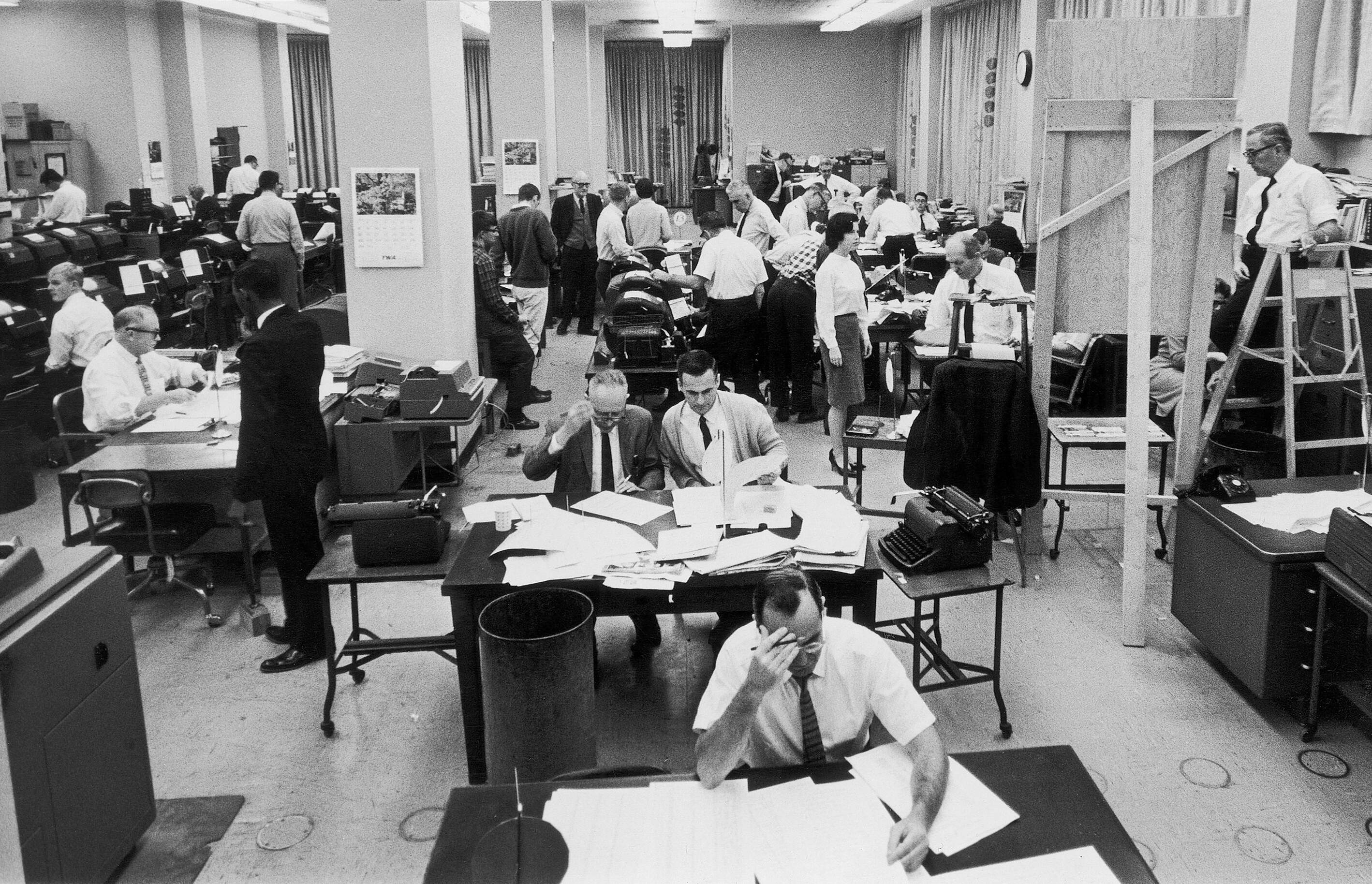 Staffers work on election night at the Washington bureau of The Associated Press on Nov. 3, 1964. (AP)