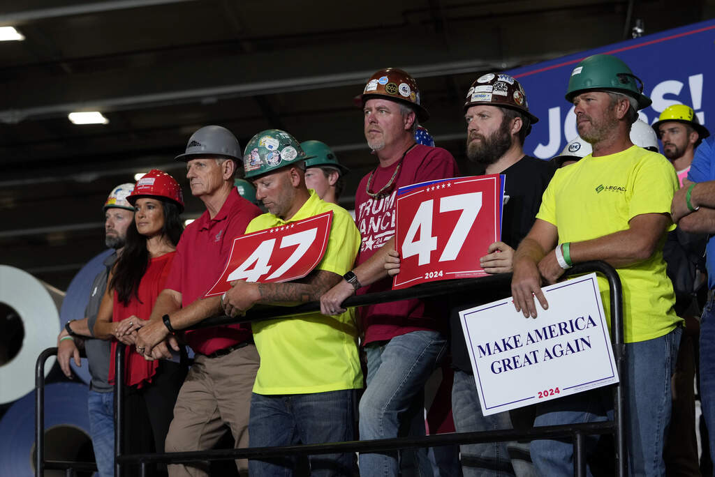 People arrive before Republican presidential nominee former President Donald Trump speaks at a campaign event, Sept. 27, 2024 in Walker, Mich. (AP Photo/Carlos Osorio, File)