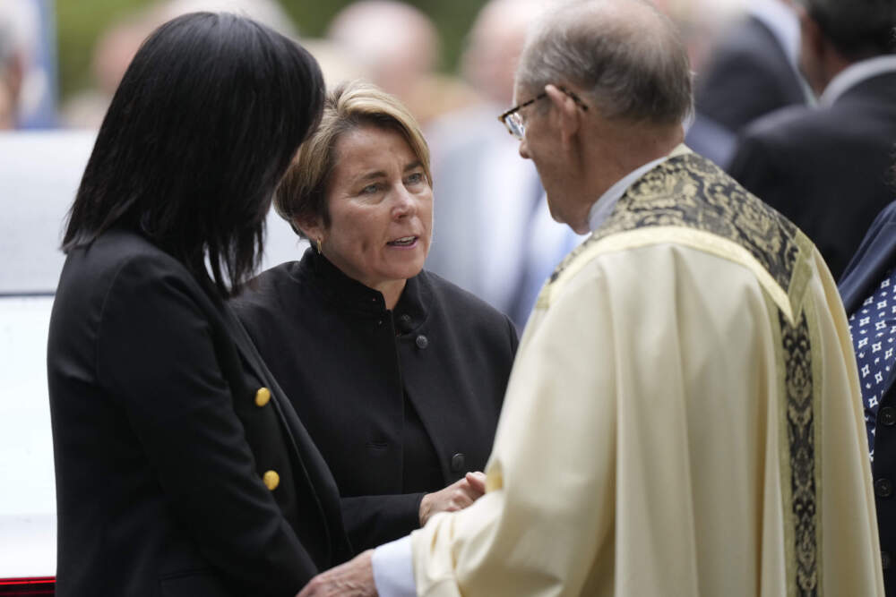 Massachusetts Gov. Maura Healey, center, speaks with Monsignor Kenneth Velo, right, following funeral services for Ethel Kennedy. (Steven Senne/AP)
