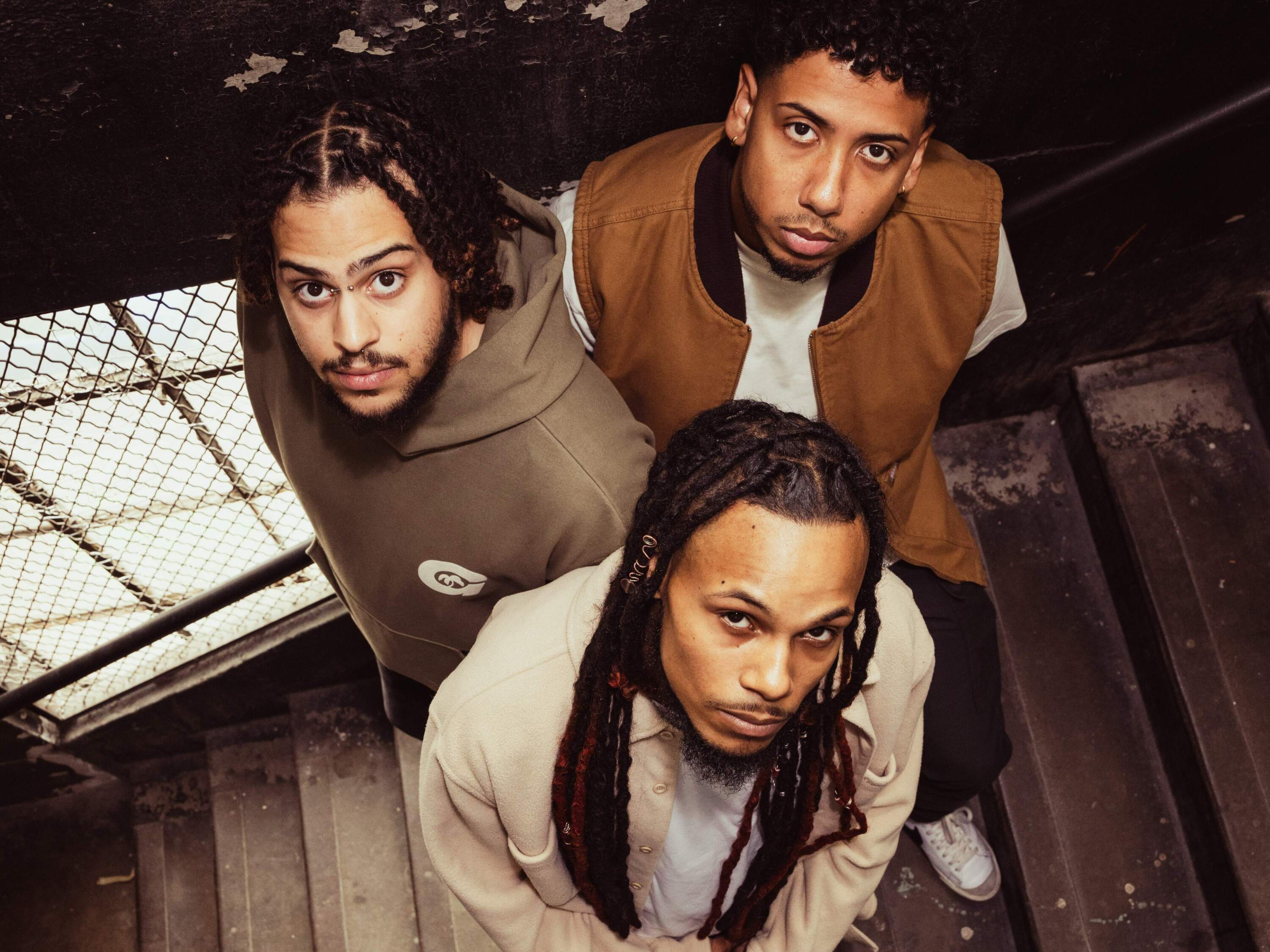 The members of Glasshouse clockwise from left: Luis Luna, aka Luna, Gerald Liriano, aka Liri, and Jahmo Elijah Chavez, aka Elijae. (Olivia Moon Photography for WBUR)