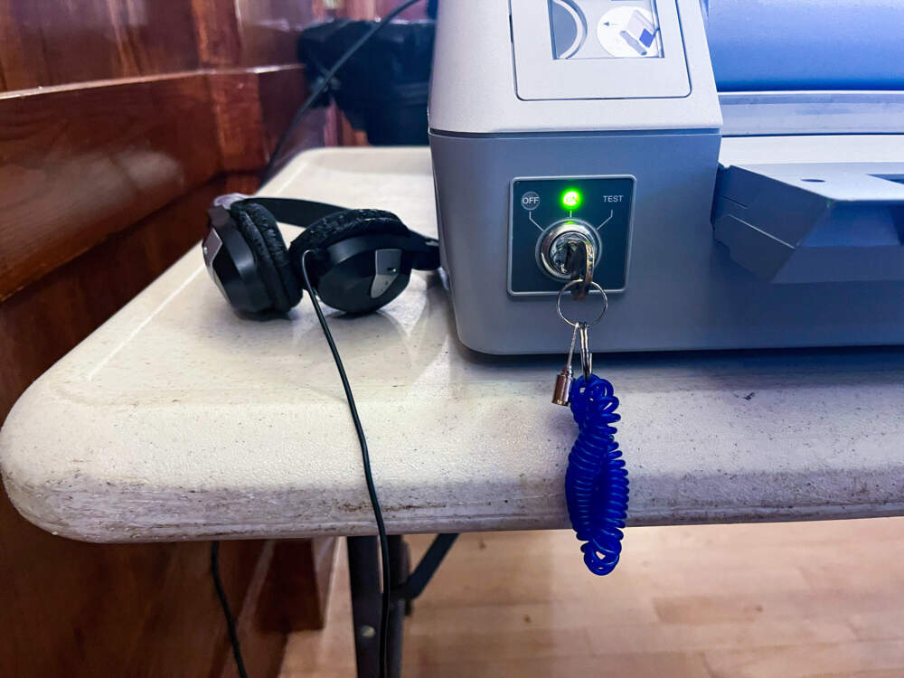 Headphones that voters using AutoMARK machines wear to hear their ballot options. (Emily Piper-Vallillo/WBUR)