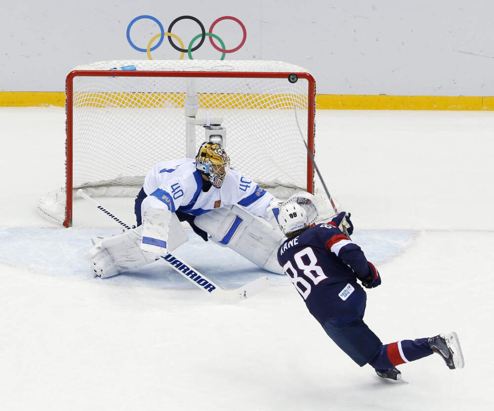 USA forward Patrick Kane hits the post as he shoots on Finland goaltender Tuukka Rask during the second period of the men's bronze medal ice hockey game at the 2014 Winter Olympics, Feb. 22, 2014, in Sochi, Russia. (David J. Phillip/AP)