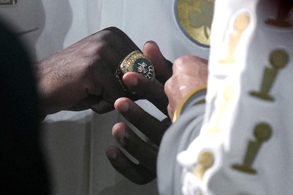 Boston Celtics guard Jaylen Brown admires his ring. (Charles Krupa/AP)