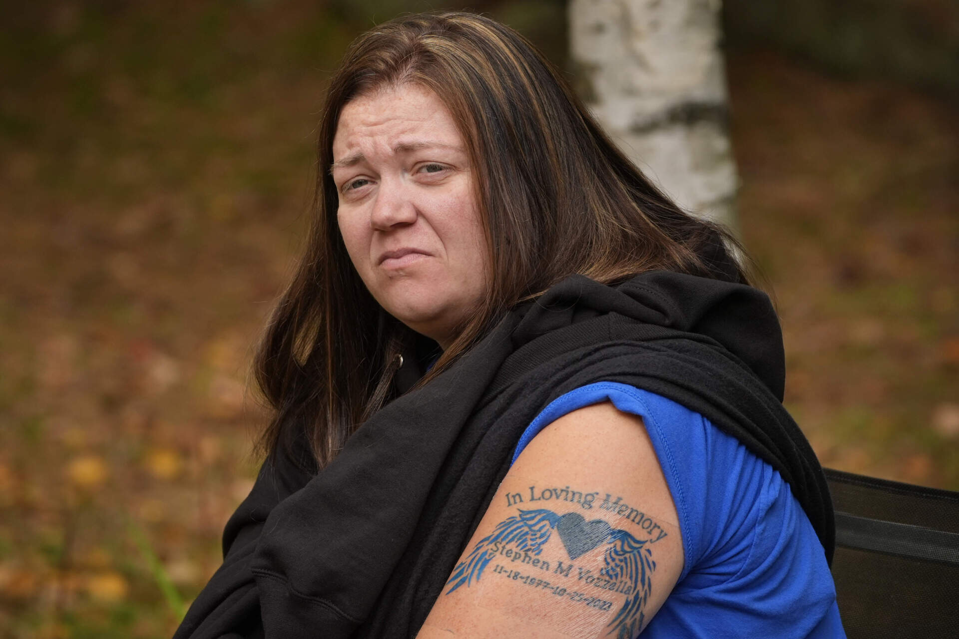 Megan Vozzella shows off a tattoo she got in memory of her late husband, Stephen Vozzella, who was one of the people killed in a mass shooting on Oct. 25, 2023, in Lewiston, Tuesday, Oct. 1, 2024, in Oxford, Maine. (AP Photo/Robert F. Bukaty)