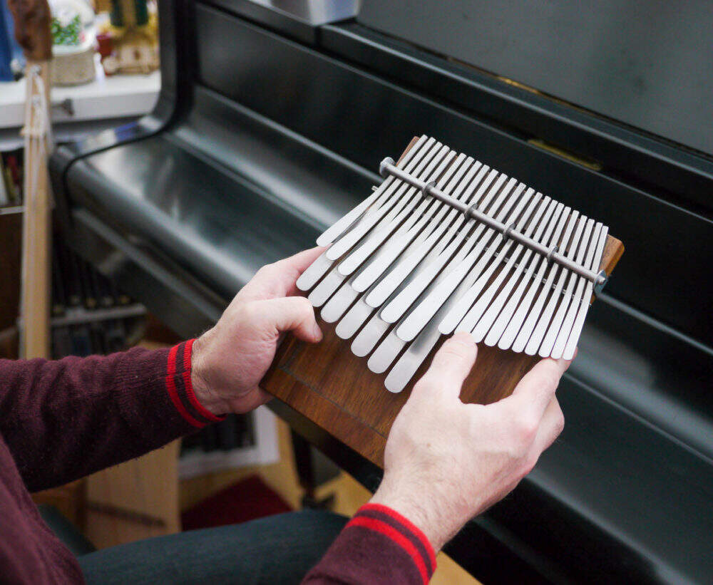 Eric Shimelonis plays the mbira, an African instrument traditionally played at religious ceremonies and social gatherings such as weddings. (courtesy of Rebecca Sheir)