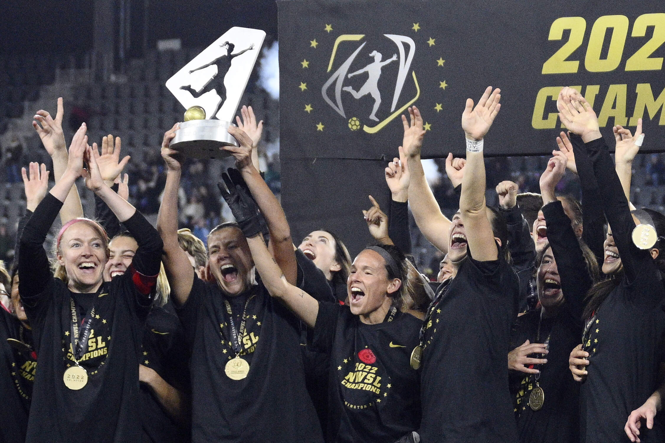 Portland Thorns FC players celebrates with the trophy after winning the NWSL championship soccer match against the Kansas City Current, on Oct. 29, 2022. (Nick Wass/AP)