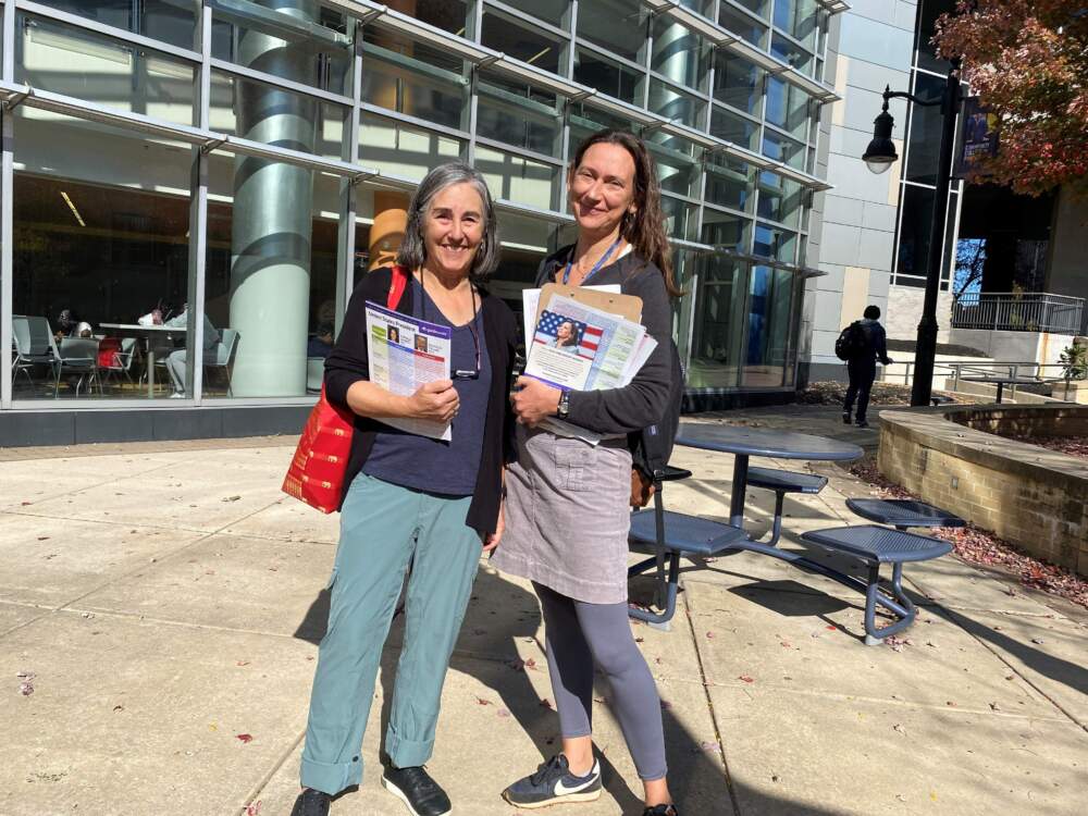 Martha Courant of Watertown and Nadia Colburn of Cambridge, canvassing for V.P. Kamala Harris in front of Philadelphia Community College. (Anthony Brooks/WBUR)