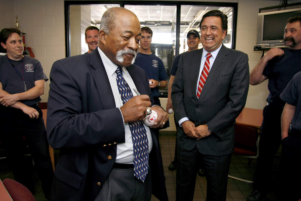 Luis Tiant signs baseballs for firefighters at the Manchester Fire Department in Manchester, N.H., May 7, 2007. (Cheryl Senter/AP)