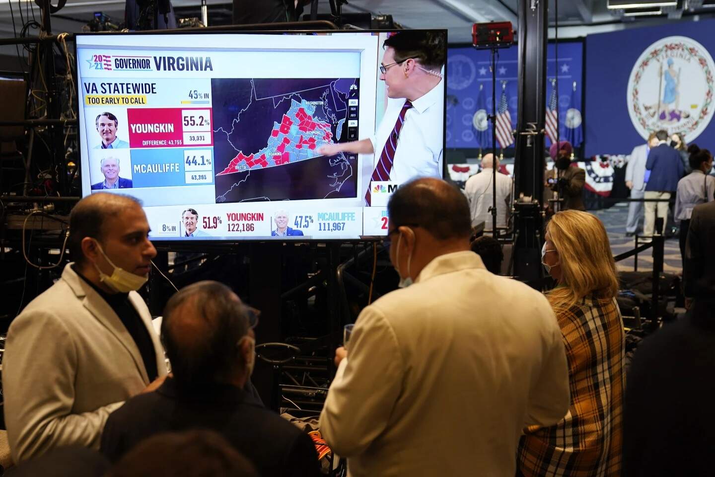Supporters of Democrat Terry McAuliffe watch vote reports at an election party in McLean, Va., Tuesday, Nov. 2, 2021. (Steve Helber/AP)