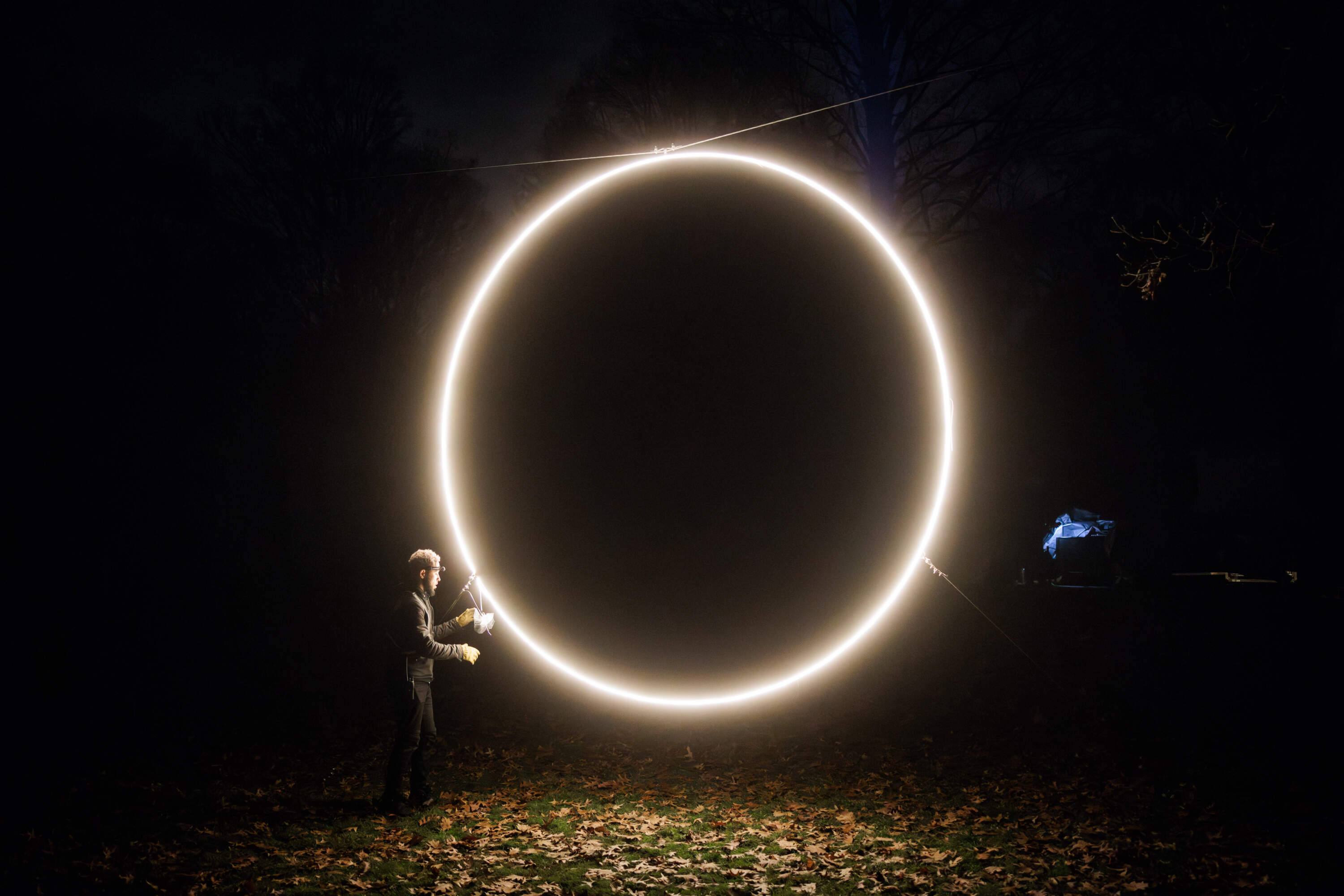 Caleb Hawkins works on the installation of "Eclipse," part of "SOLSTICE" at Mount Auburn Cemetery. (Courtesy Aram Boghosian)
