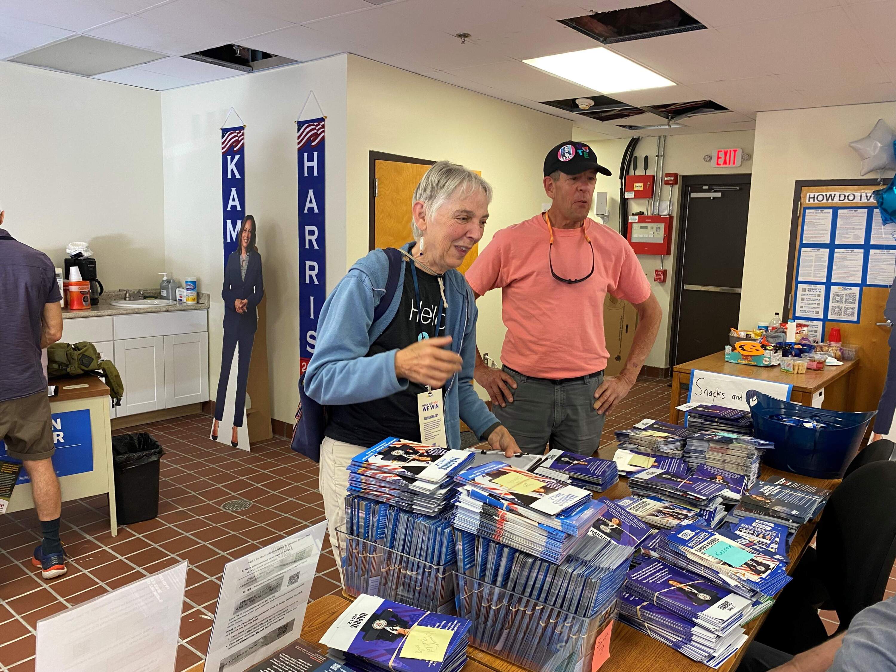 Sue Donaldson and Rob Robertson check in at the Harris campaign headquarters in Chester, PA. before heading out to canvas.