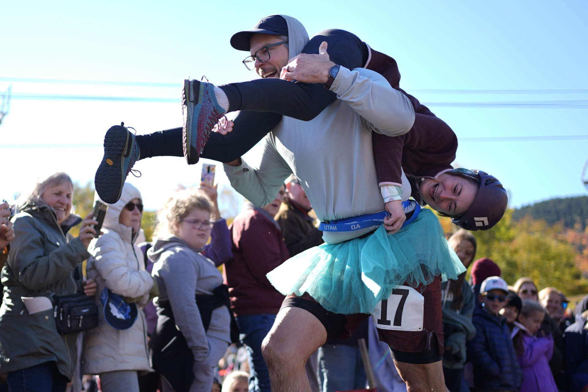 Galen Staats carries Amy Bannon during the North American Wife Carrying Championship. (Robert F. Bukaty/AP)