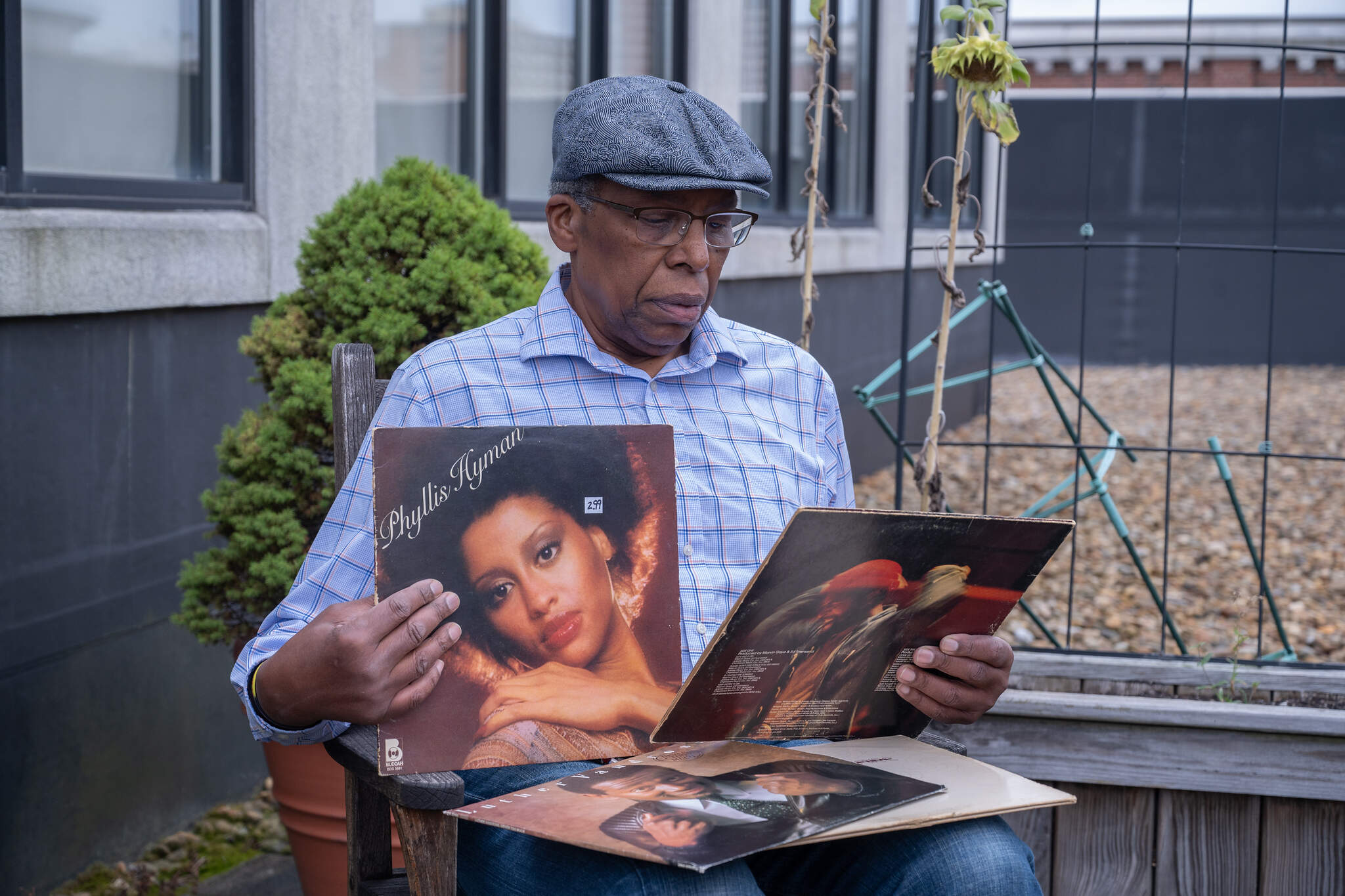 René Marchando, a 40-year Sunday night radio host at WMBR, flips through records. (Sharon Brody/WBUR)