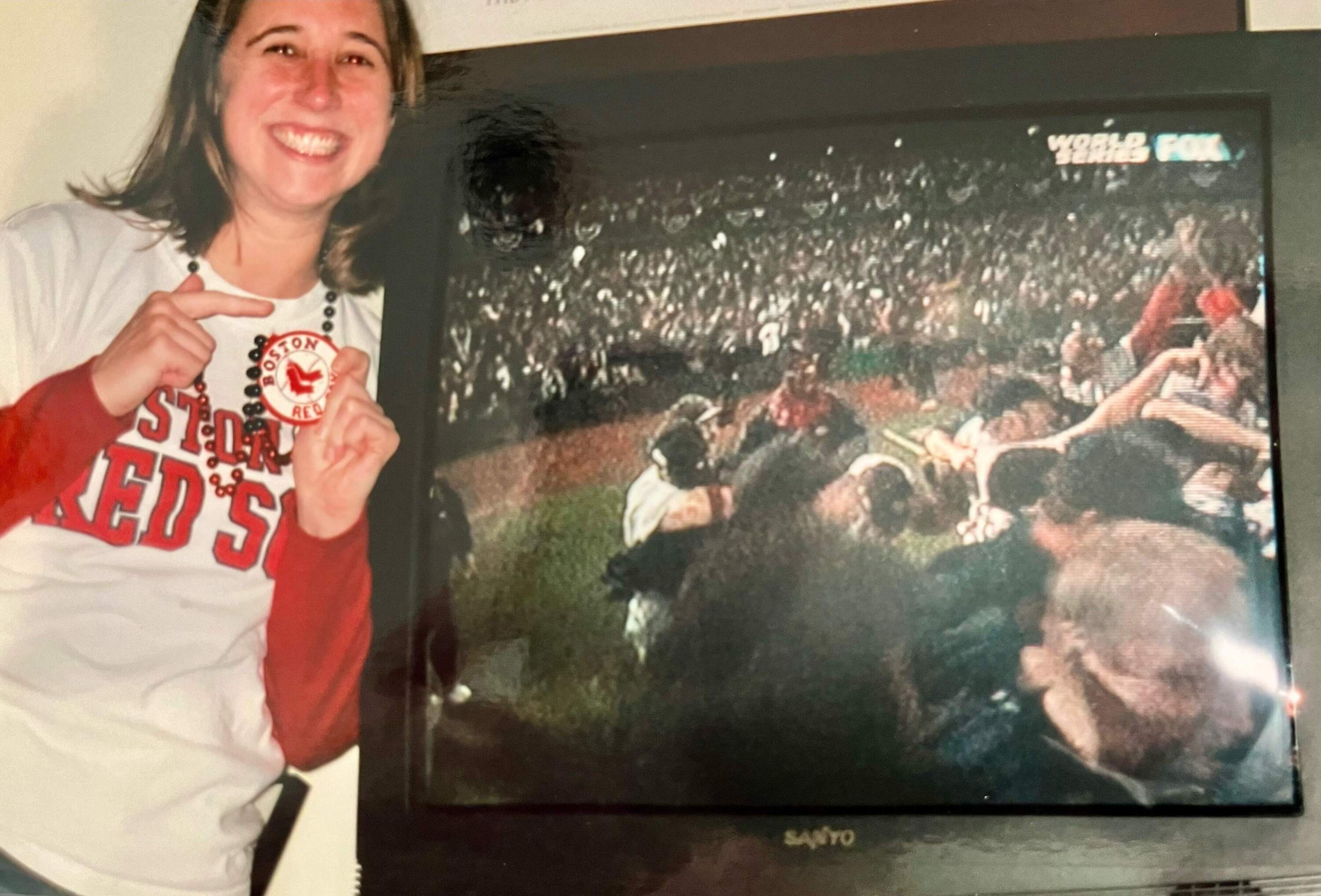 Andrea Schneider watching the Red Sox World Series at her apartment in Boston wearing her good luck beads. (Courtesy to Andrea Schneider) 