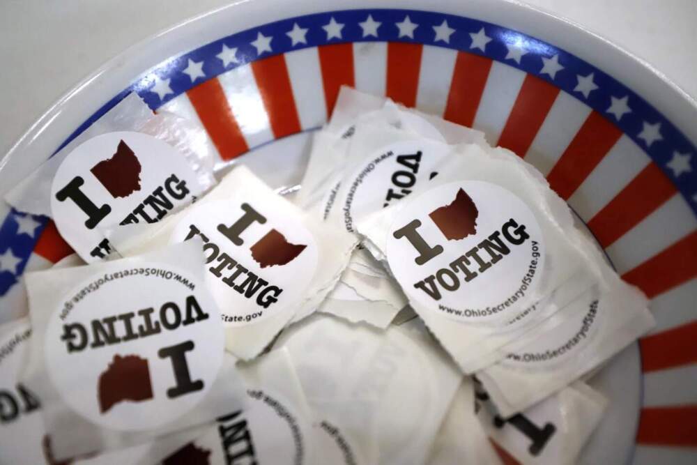 A bowl of voting stickers for early voters is show March 15, 2020, in Steubenville Ohio. (Gene J. Puskar/AP)