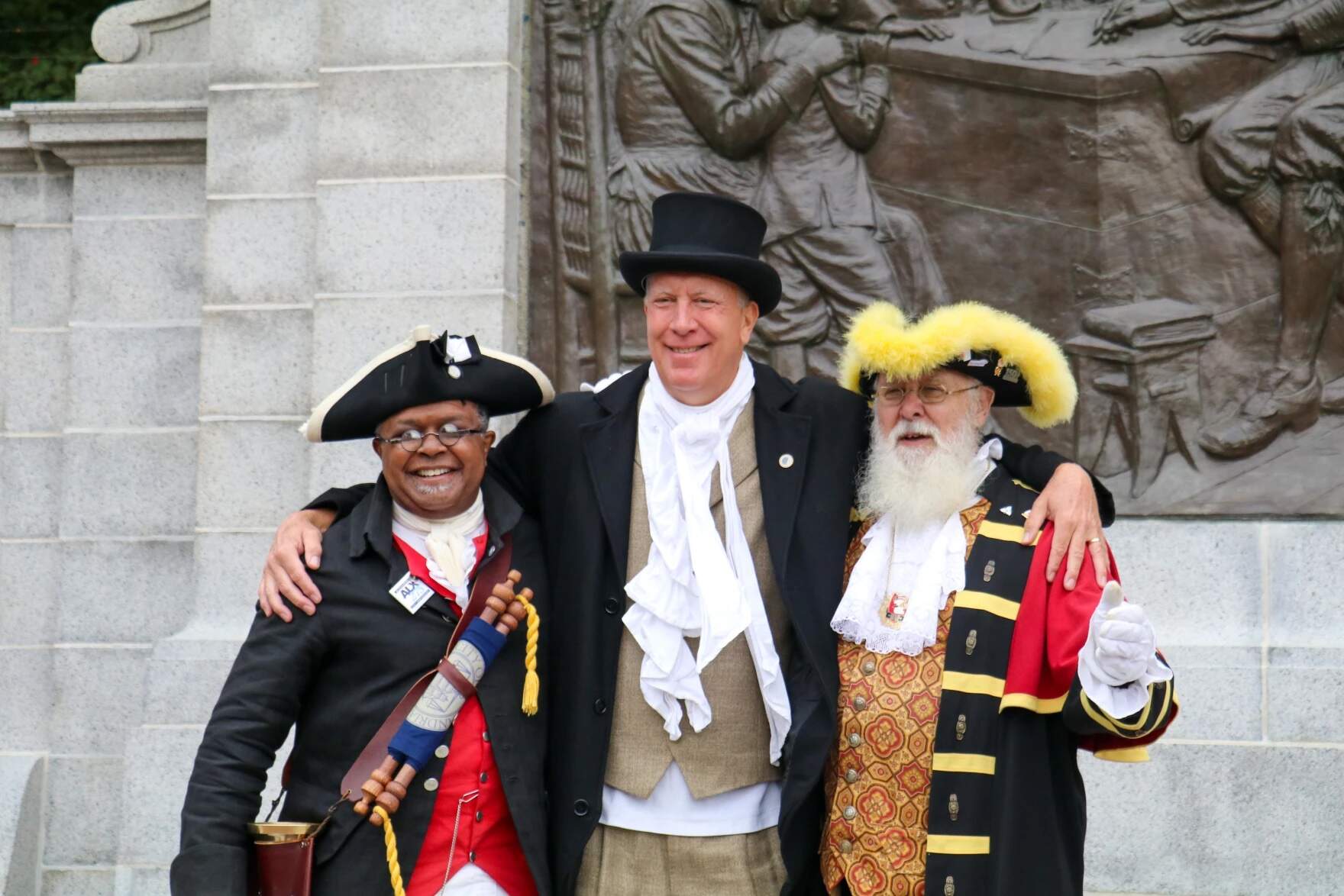 Town criers Ben Fiore-Walker of Alexandria, Virginia, Eric Goddard of Nantucket, and David Vollick of Burlington, Ontario. (Liz Lerner/CAI)