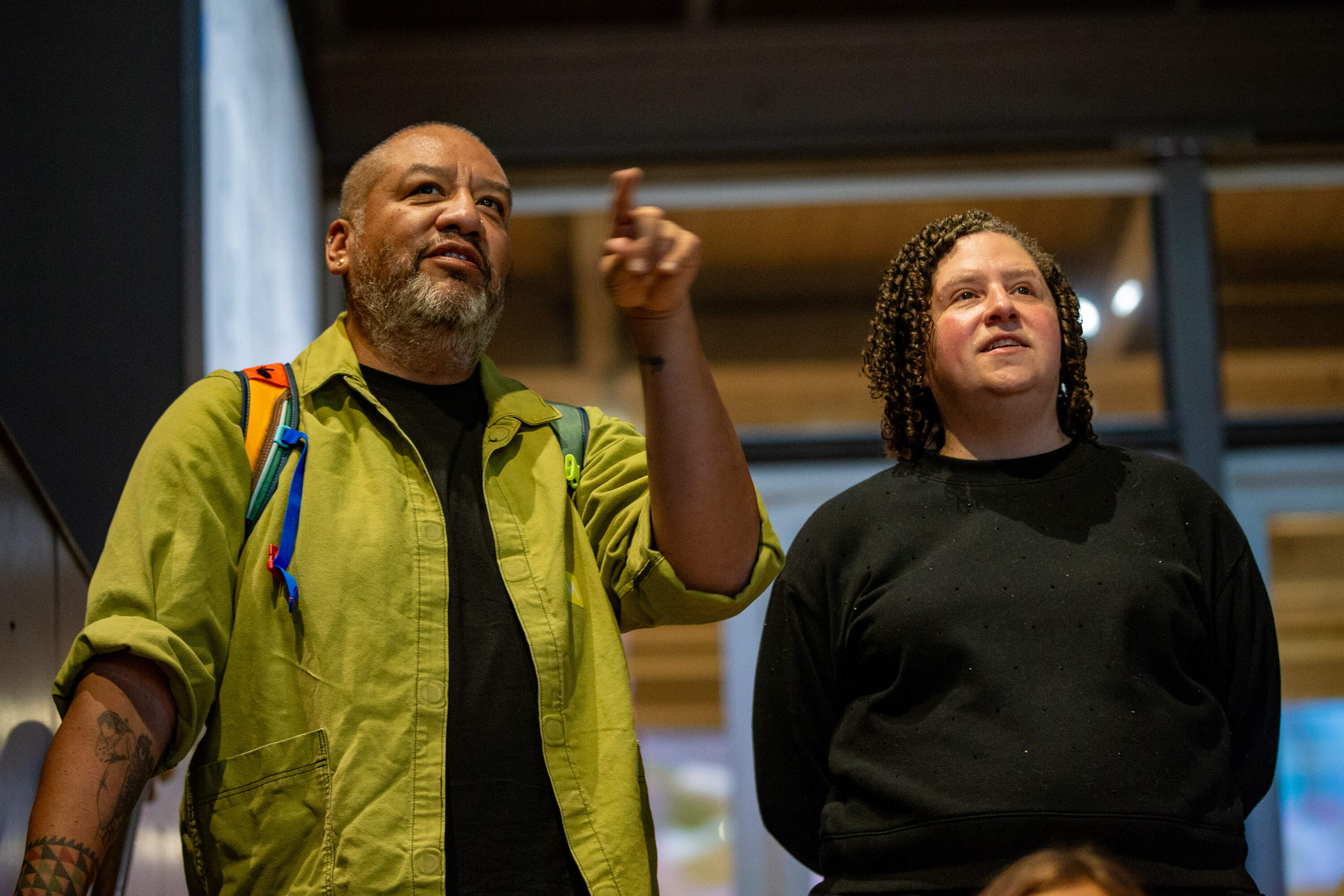 Jeffrey Gibson and curator Denise Markonish contemplate the great garments he created. (Jesse Costa/WBUR)