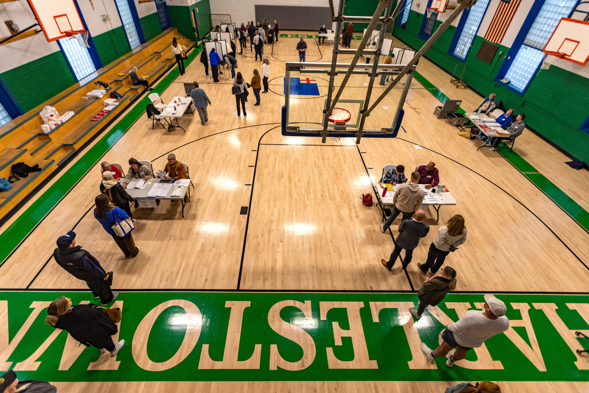 Residents check in and head voting booths at the Charlestown Boys and Girls Club just after 7 a.m. on Nov. 5, 2024. (Jesse Costa/WBUR)