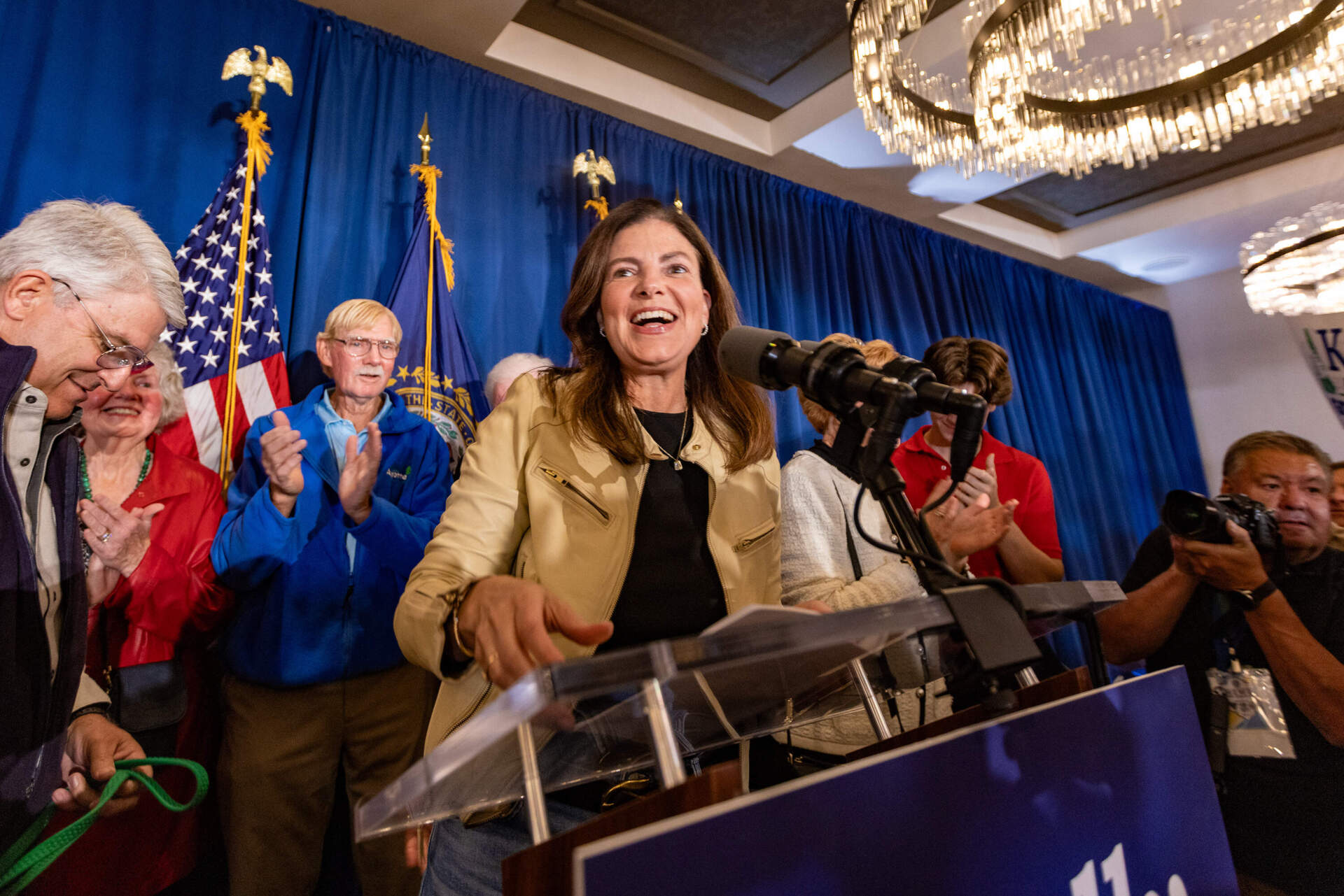 Republican candidate Kelly Ayotte takes the stage to address supporters as the next governor of New Hampshire at the Artisan at Tuscan Village in Salem. (Jesse Costa/WBUR)