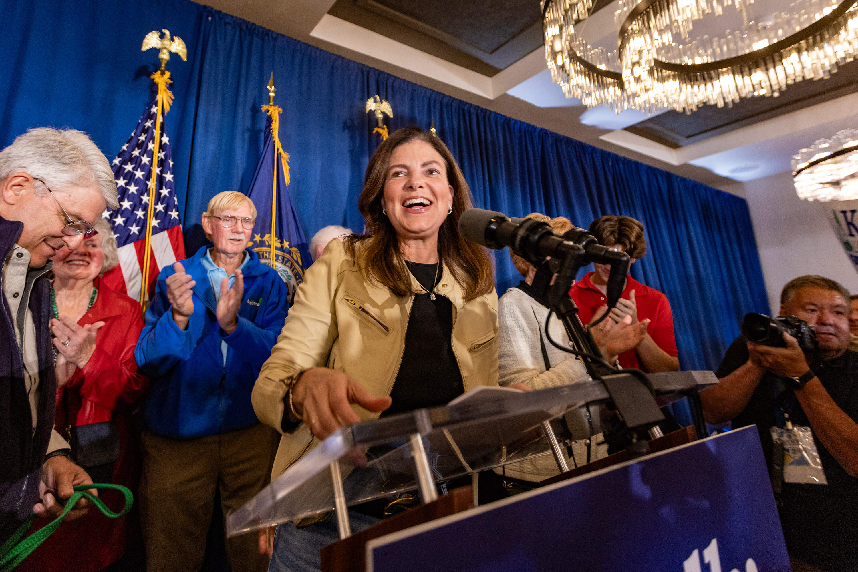 Republican candidate Kelly Ayotte takes the stage to address supporters as the next governor of New Hampshire at the Artisan at Tuscan Village in Salem. (Jesse Costa/WBUR)