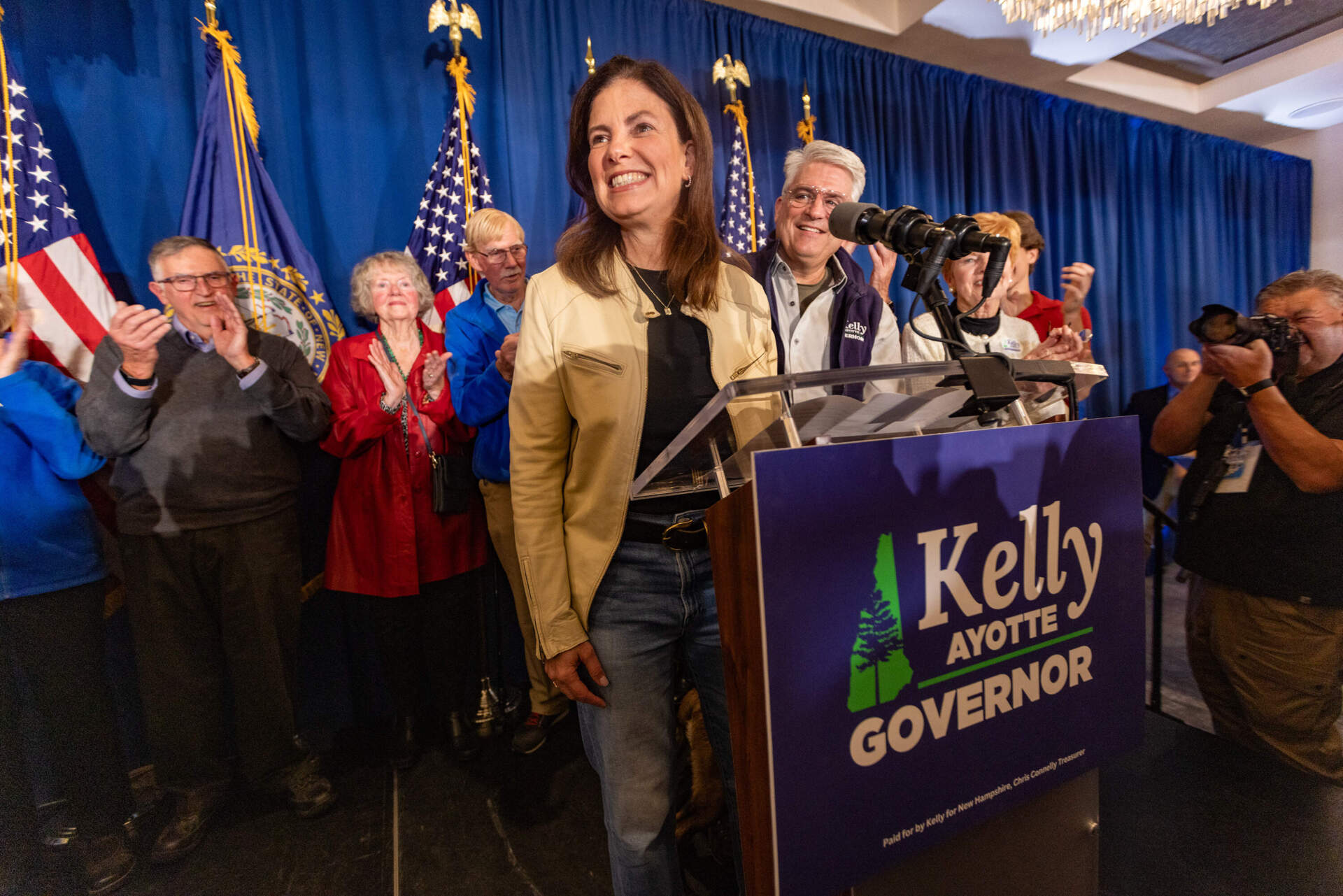 Republican candidate Kelly Ayotte smiles as she addresses supporters at the Artisan at Tuscan Village in Salem as the next governor of New Hampshire. (Jesse Costa/WBUR)
