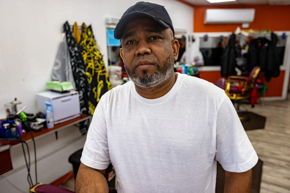 Barber Henry Reynoso supports Trump on economic grounds. (Jesse Costa/WBUR)