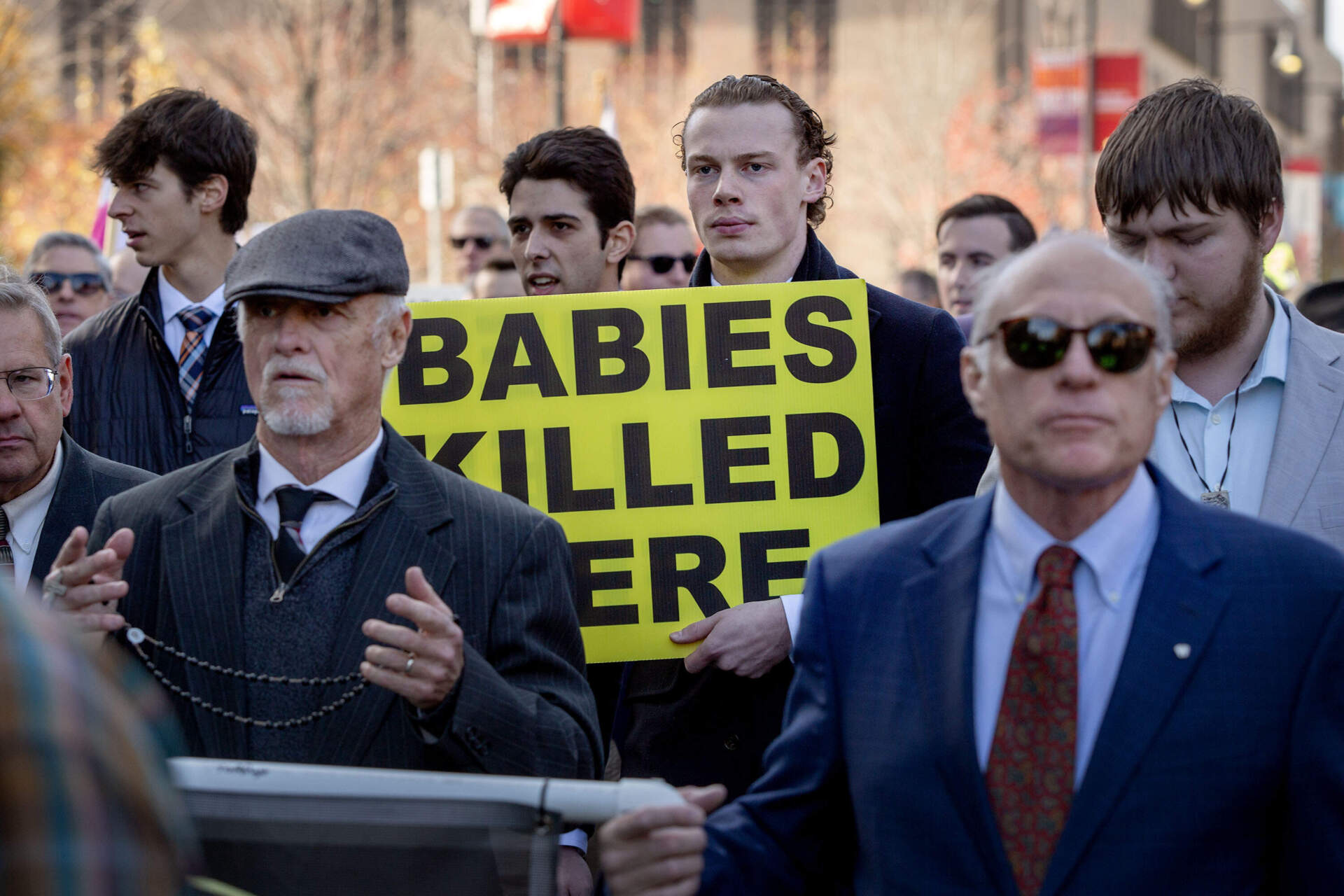 Anti-abortion protesters proceed along Commonwealth Avenue. (Robin Lubbock/WBUR)