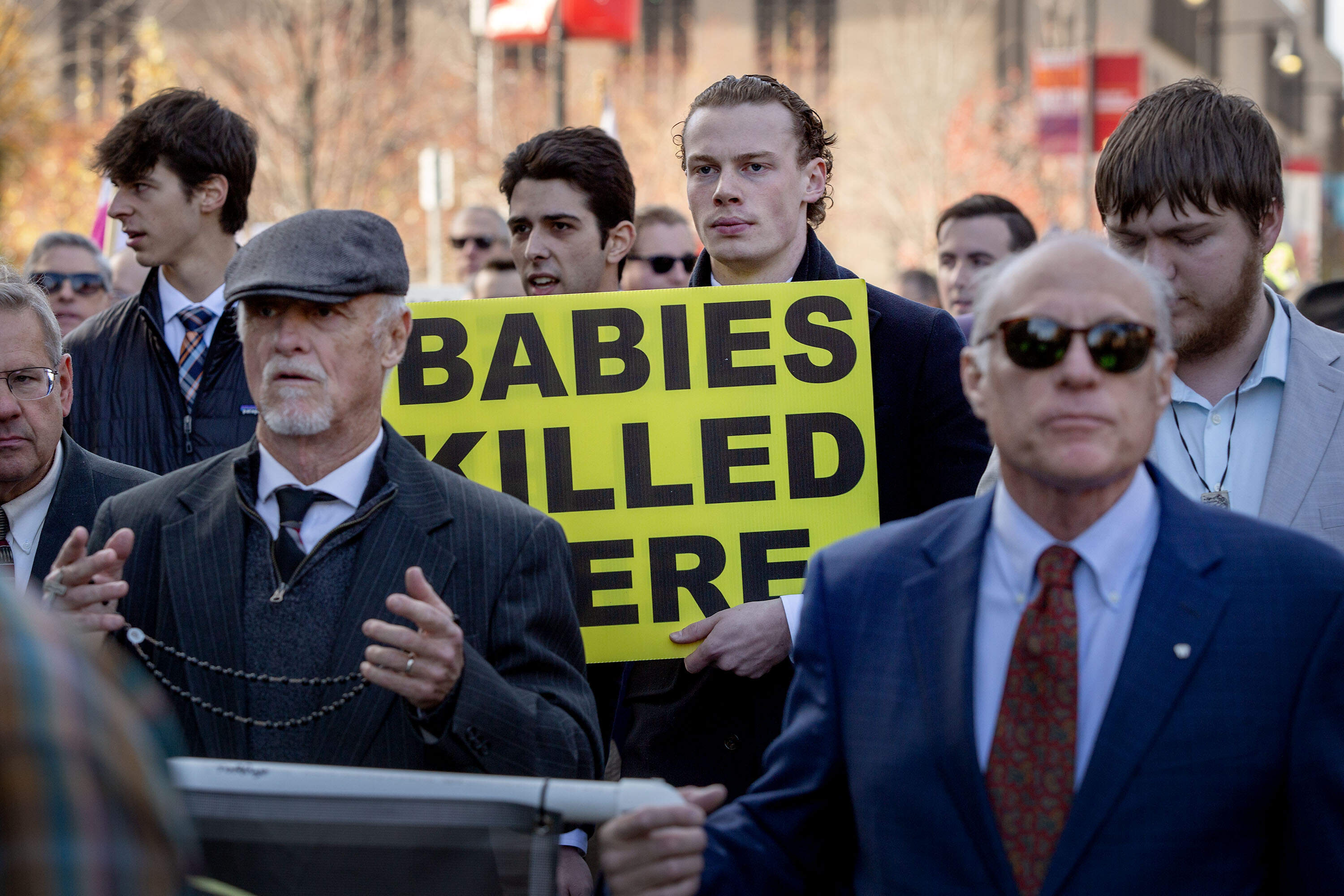 Anti-abortion protesters proceed along Commonwealth Avenue. (Robin Lubbock/WBUR)