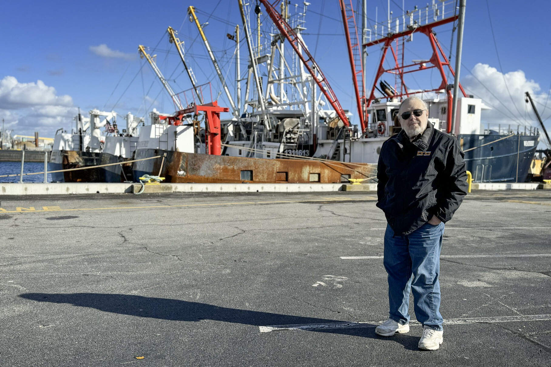 Retired scallop boat captain Jim Kendall on New Bedford's main fishing pier. (Walter Wuthmann/WBUR)