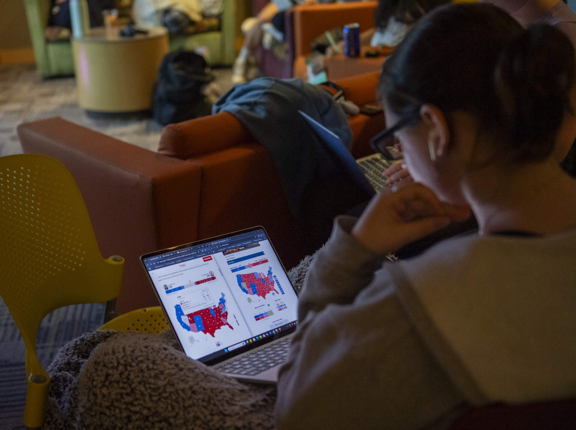 Students track election results at Simmons on Tuesday night. (Amanda Sabga for WBUR)