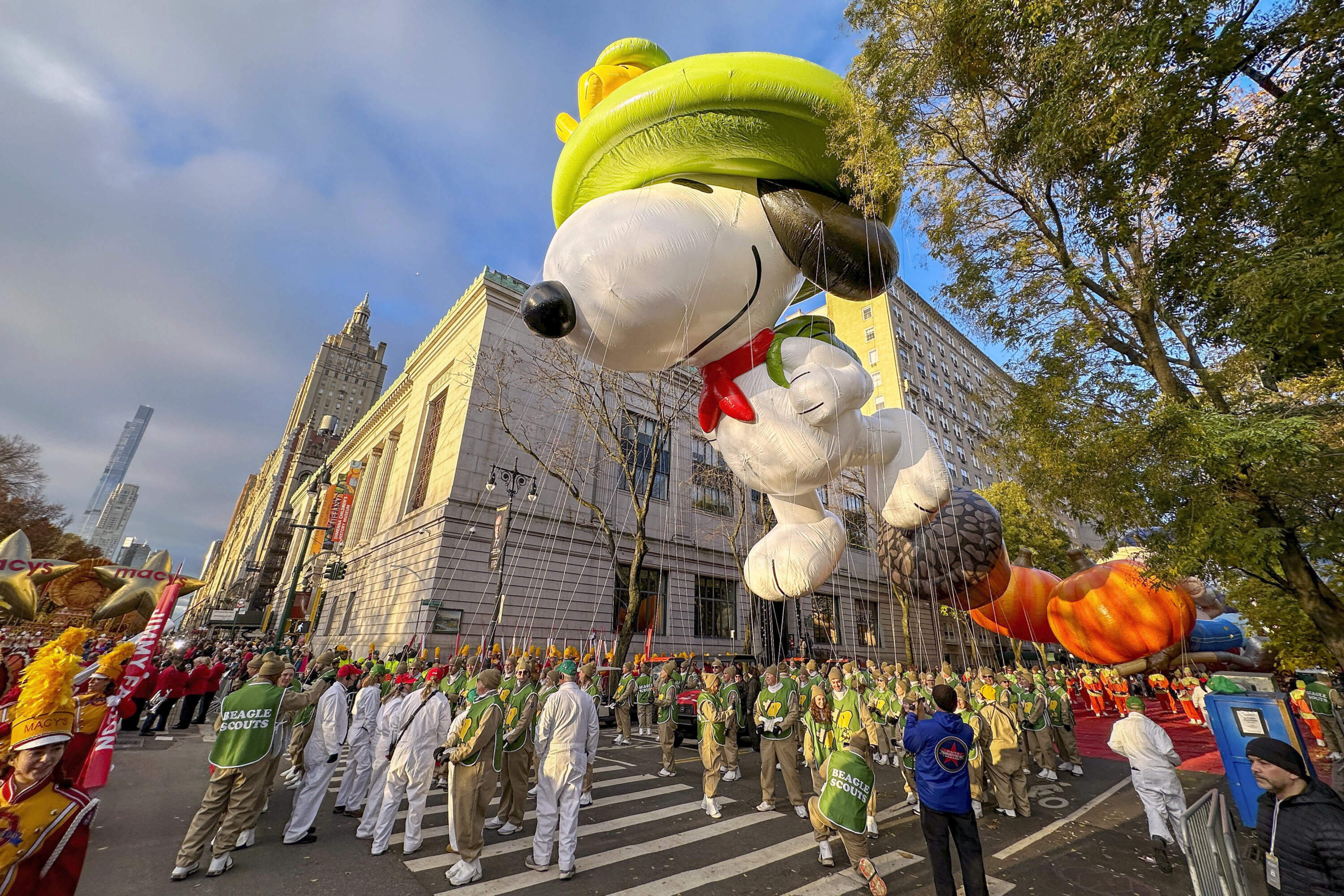 A Beagle Scout Snoopy balloon floats above Central Park West in New York during the Macy's Thanksgiving Day Parade on Thursday, Nov. 23, 2023. (Ted Shaffrey/AP)