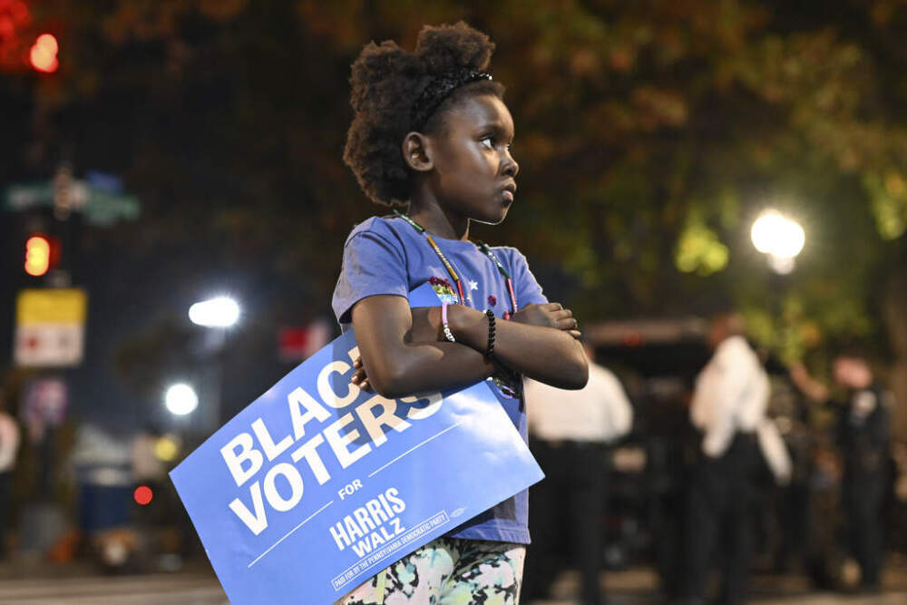 A young girl holds a &quot;Black Voters for Harris-Walz&quot; sign outside of Democratic presidential nominee Vice President Kamala Harris' election night watch party at Howard University, Tuesday, Nov. 5, 2024, in Washington. (Terrance Williams/AP)