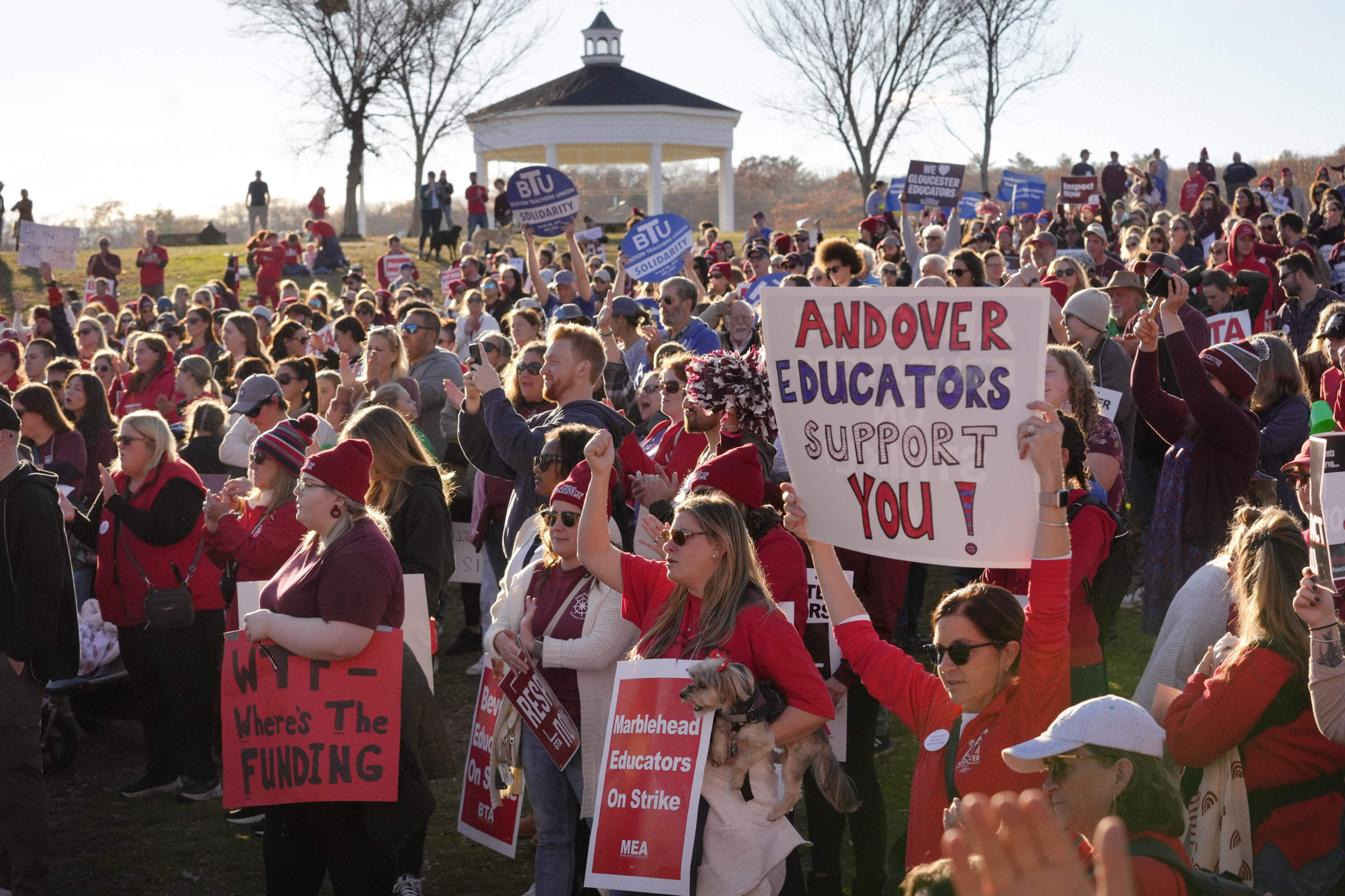 Teachers and supporters rally on Monday, Nov. 11, in Gloucester as strikes in three North Shore communities continue over pay, paid parental leave, and other issues. (Steven Senne/AP)