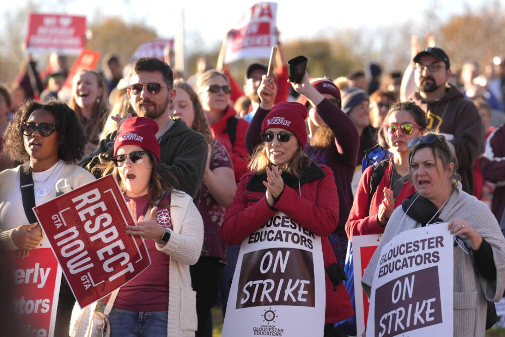 Supporters join striking teachers at a rally in Gloucester on Monday. (Steven Senne/AP)
