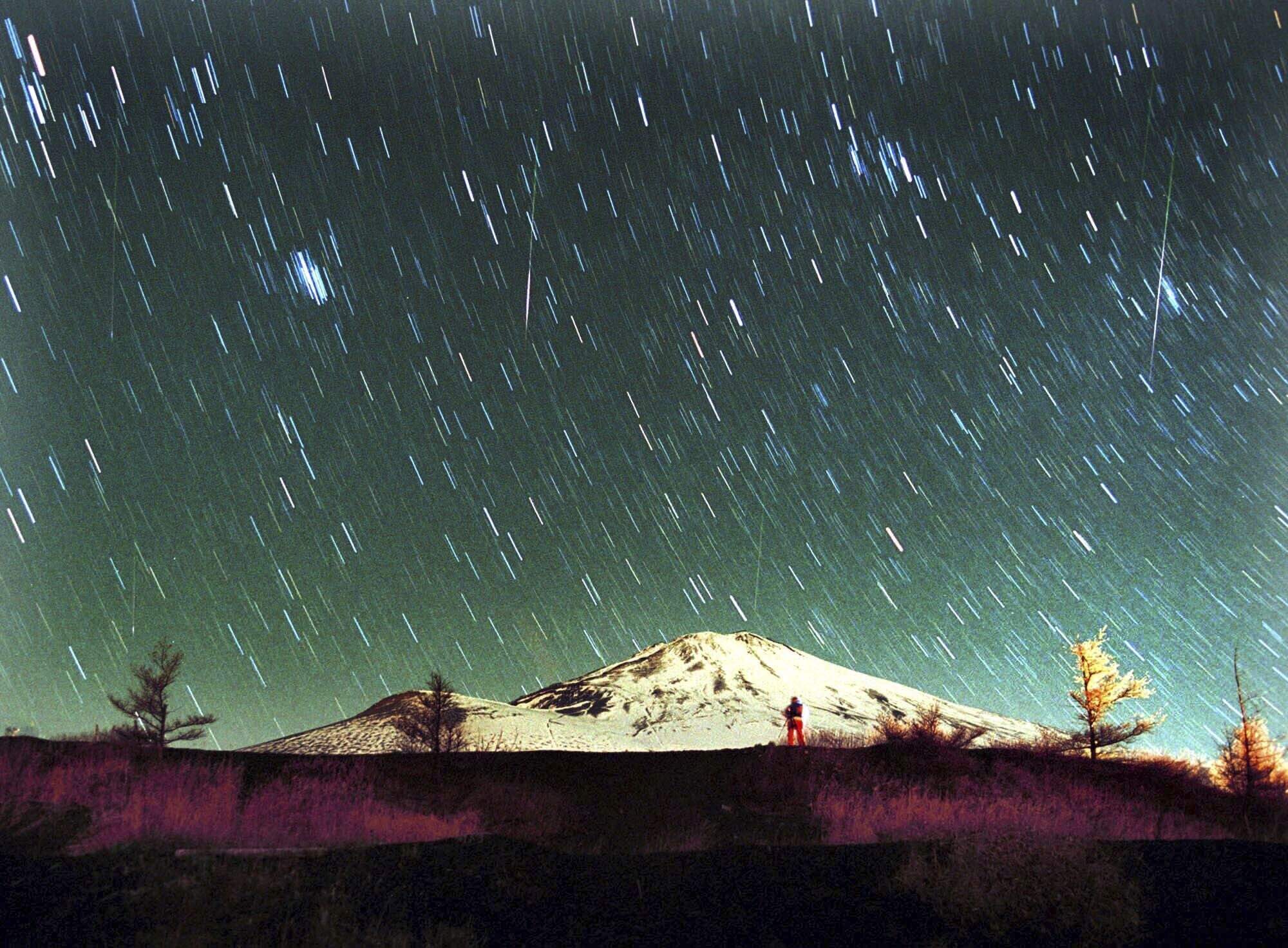 Leonid meteors are seen in Japan in this 7-minute exposure photo taken on Nov. 19, 2001. (Itsuo Inouye/AP)