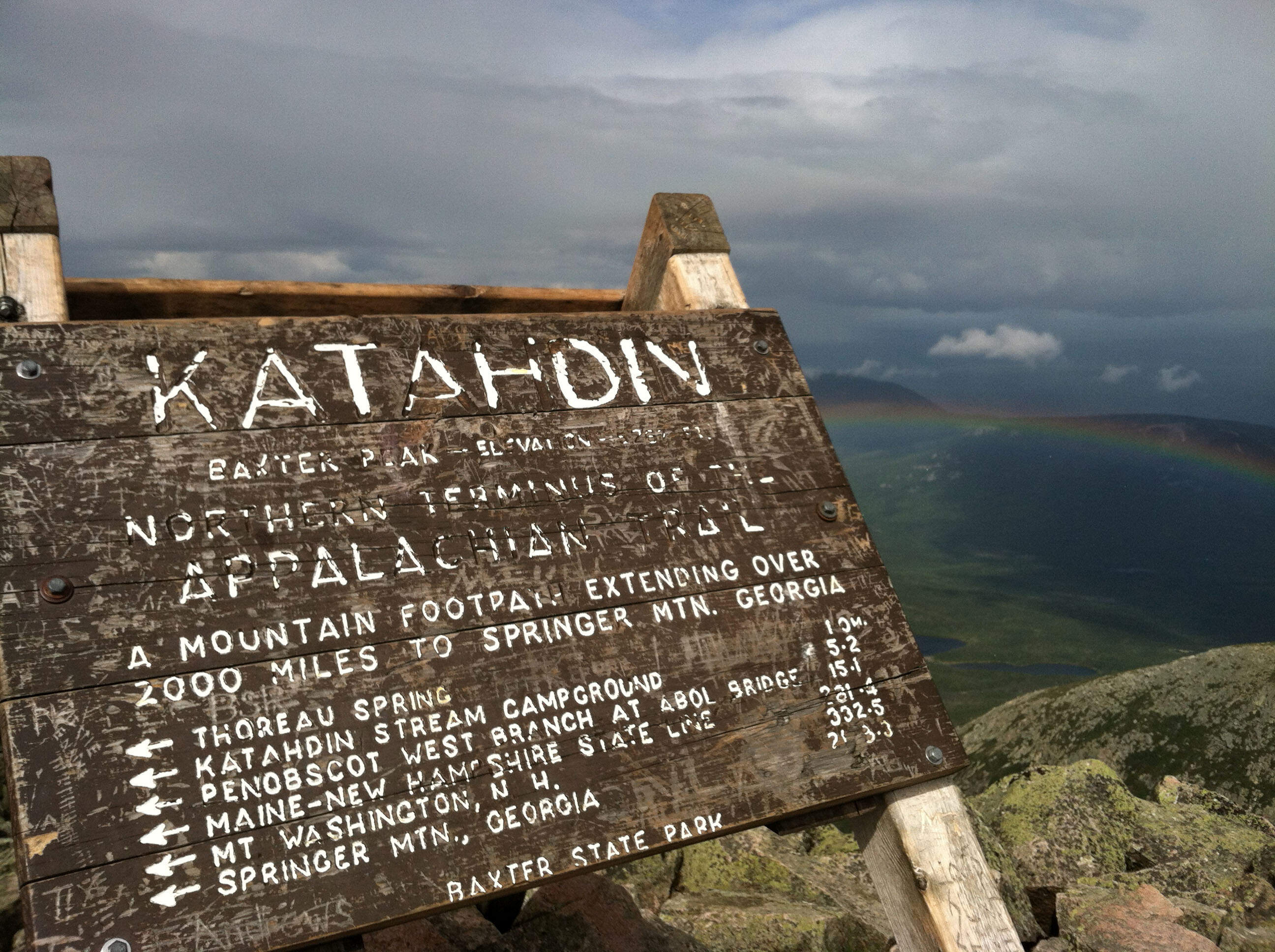 A weather-worn sign at the peak of Mount Katahdin in Baxter State Park in Maine. Katahdin, the tallest mountain in Maine, is nearly a mile high and is the northern terminus of the Appalachian Trail. (Beth J. Harpaz/AP)