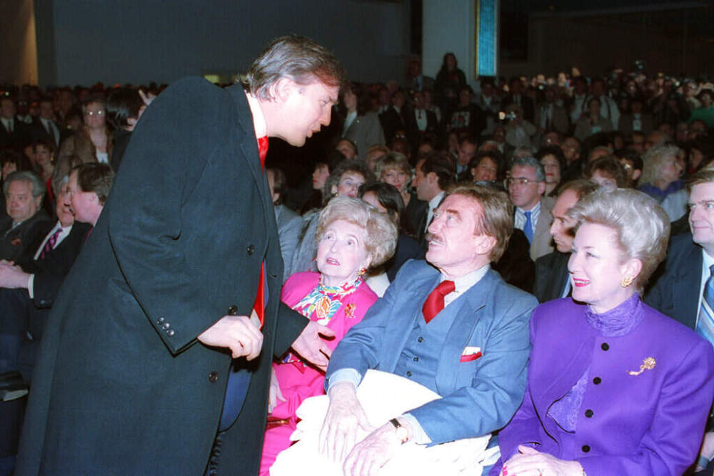 Donald Trump, left, talks with his parents, Mary and Fred and his sister, U.S. District Court Judge Maryanne Trump Barry, at the opening of Trump's Taj Mahal Casino Resort in Atlantic City, N.J., Thurs., April 5, 1990. (AP)