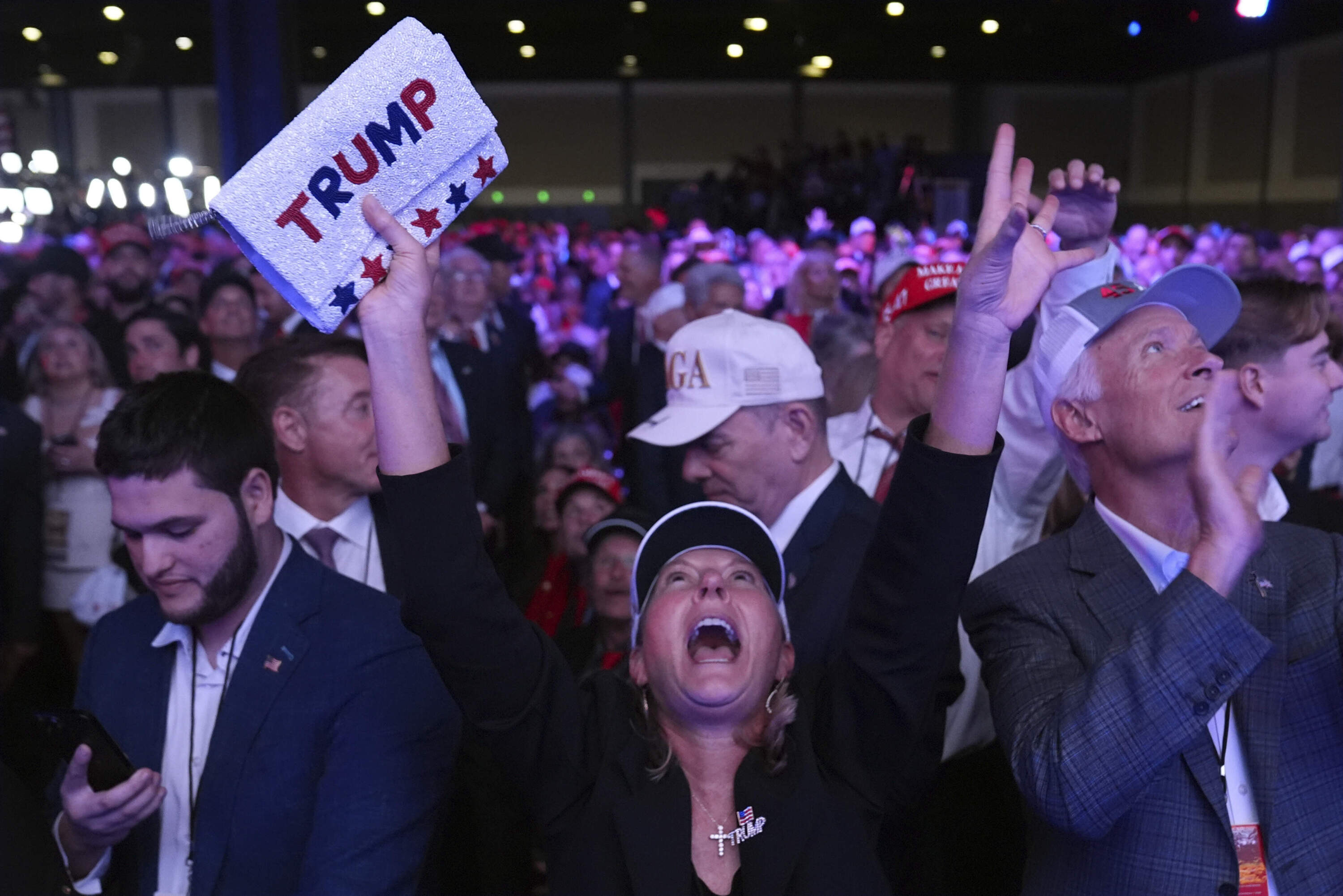 Supporters watch returns at a campaign election night watch party for Republican presidential nominee former President Donald Trump at the Palm Beach Convention Center, Wednesday, Nov. 6, 2024, in West Palm Beach, Fla. (Evan Vucci/AP)