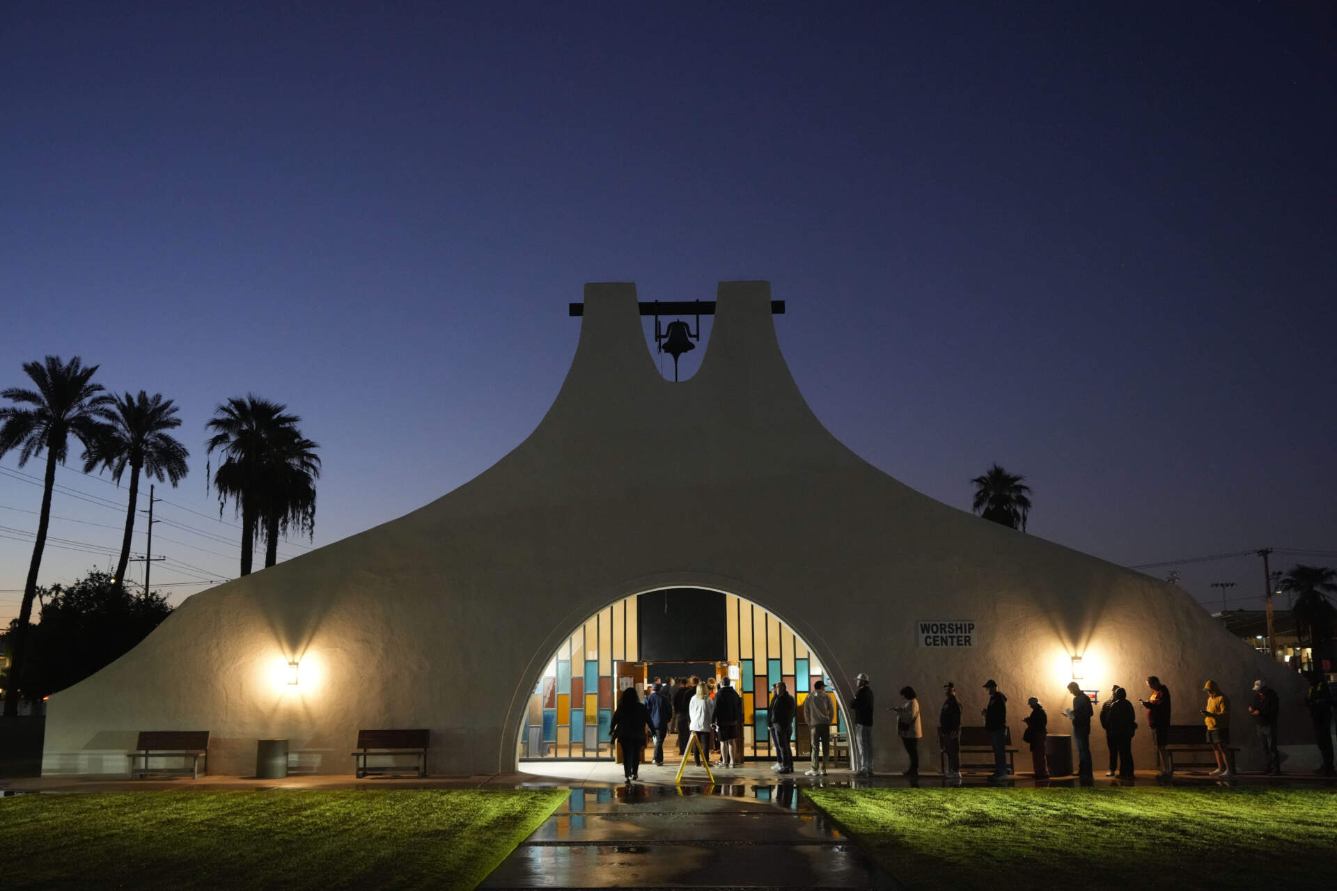 Voters stand in line outside a polling place at Madison Church in Phoenix, Ariz. (Matt York/AP)