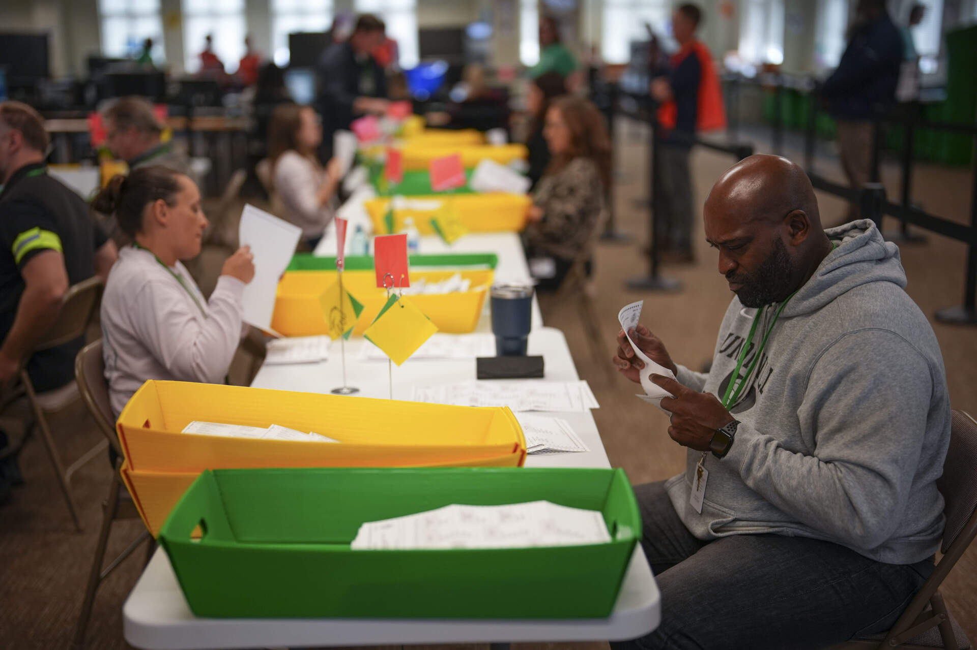 Election workers process mail-in ballots at the Chester County, Pa., administrative offices. (Matt Slocum/AP)