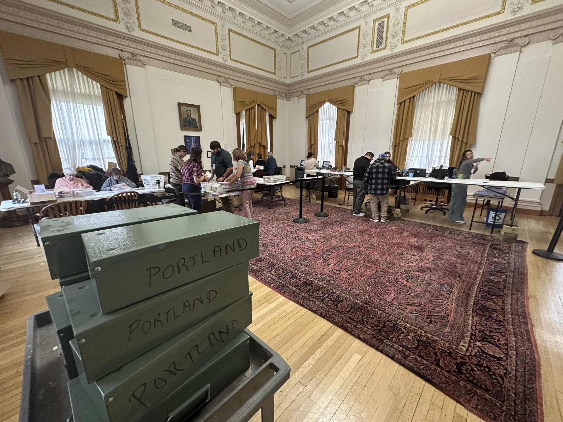 Election workers process absentee ballots and register voters at City Hall in Portland, Maine. (David Sharp/AP)