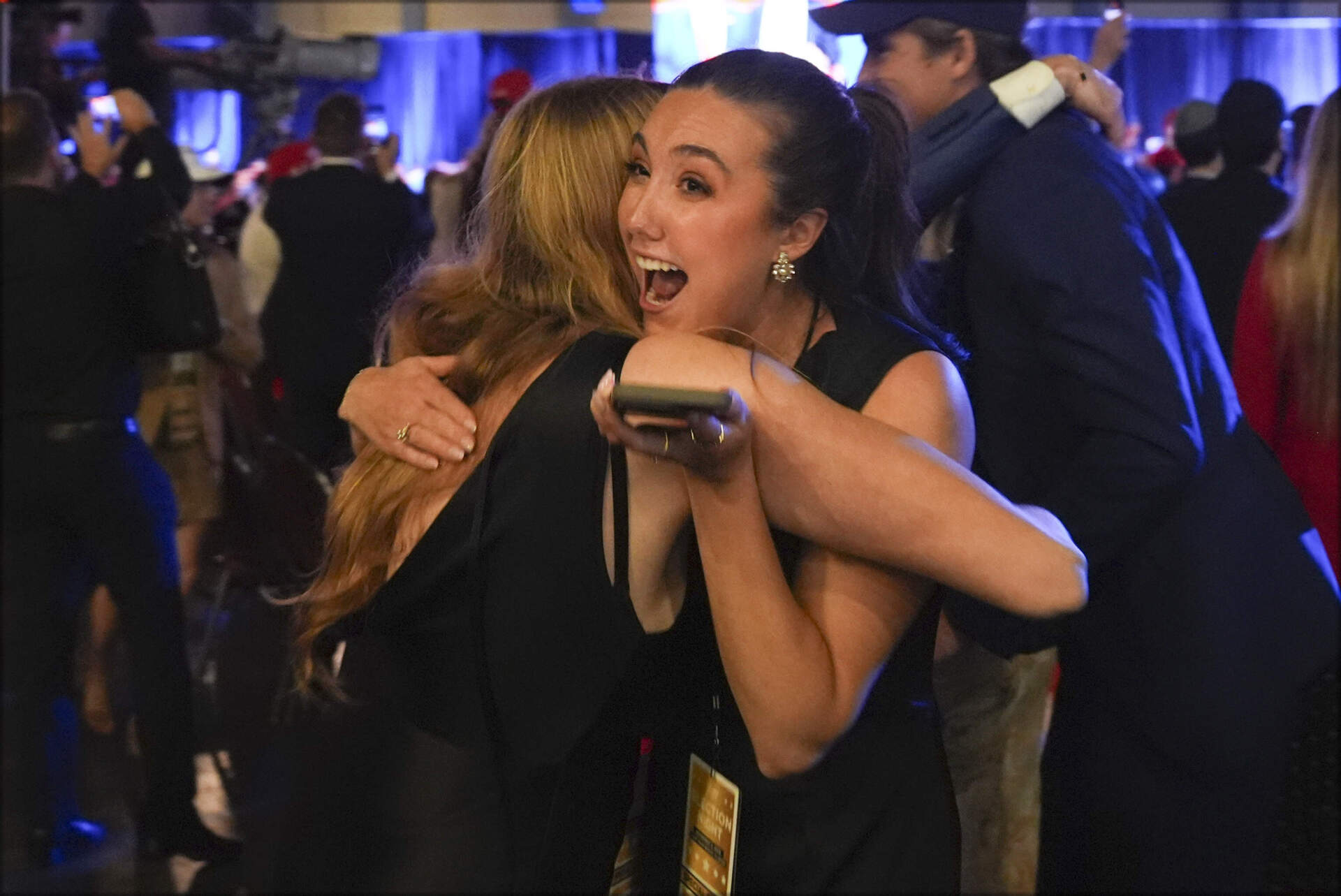 Trump supporters watch returns at a campaign election night watch party at the Palm Beach Convention Center, Wednesday, Nov. 6, 2024, in West Palm Beach, Fla. (Evan Vucci/AP)