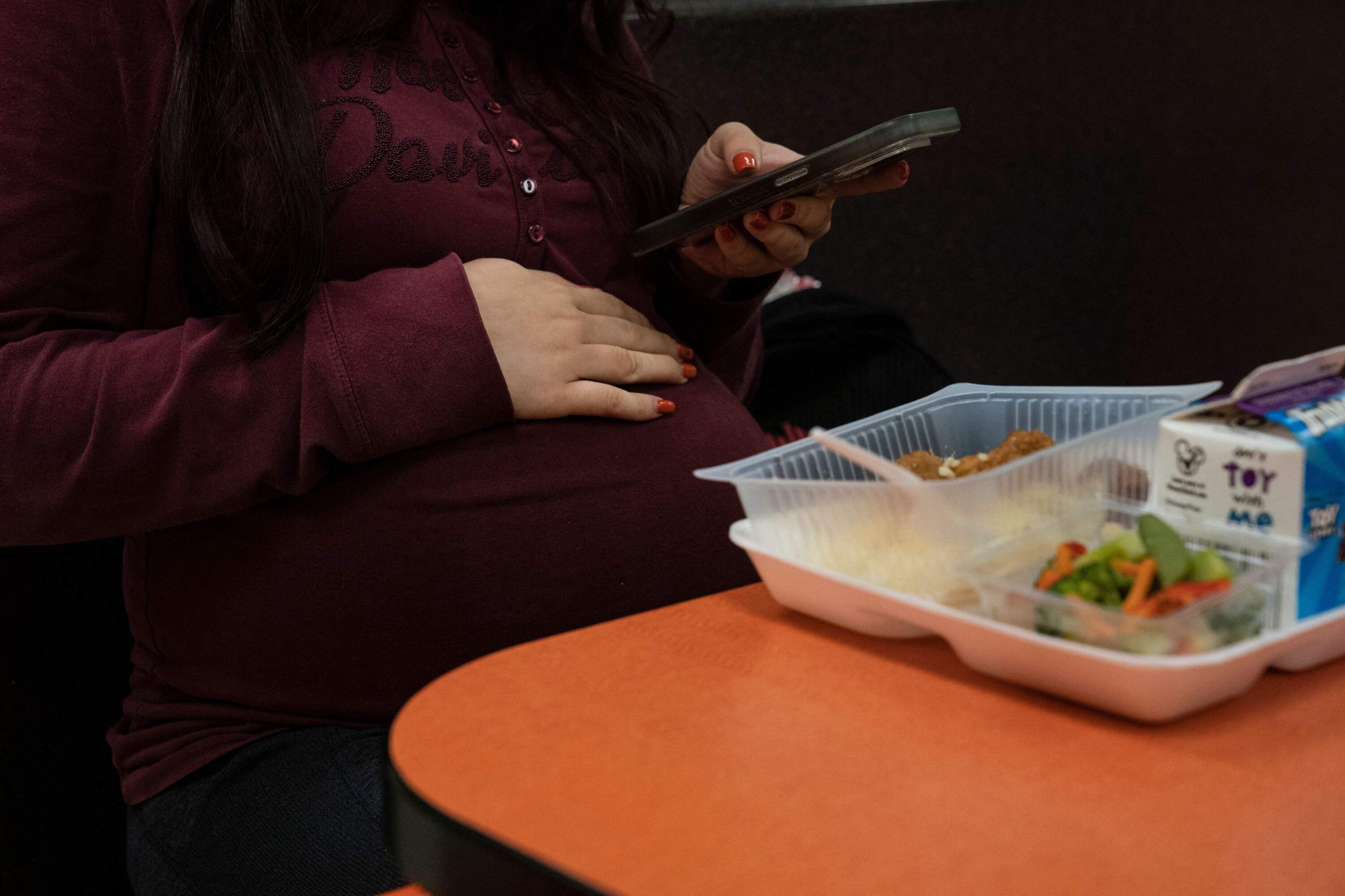 A pregnant student eats breakfast at a school for pregnant students and young mothers, in Brownsville, Texas. (Veronica G. Cardenas/AFP via Getty Images)