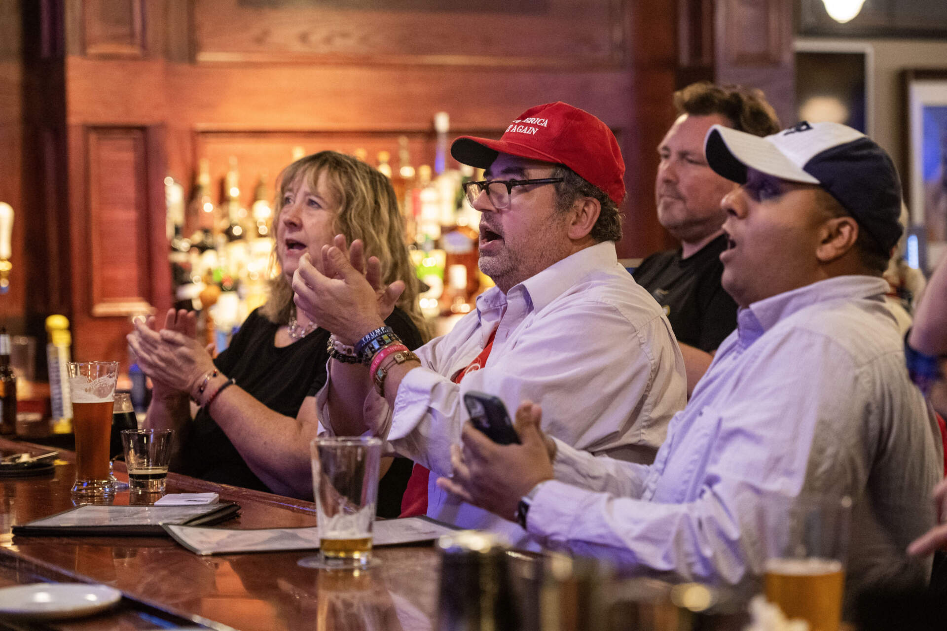 People applaud the announcement of an electoral vote for Trump at an election watch party in Manchester, New Hampshire, on November 5, 2024. (Joseph Prezioso/AFP via Getty Images)
