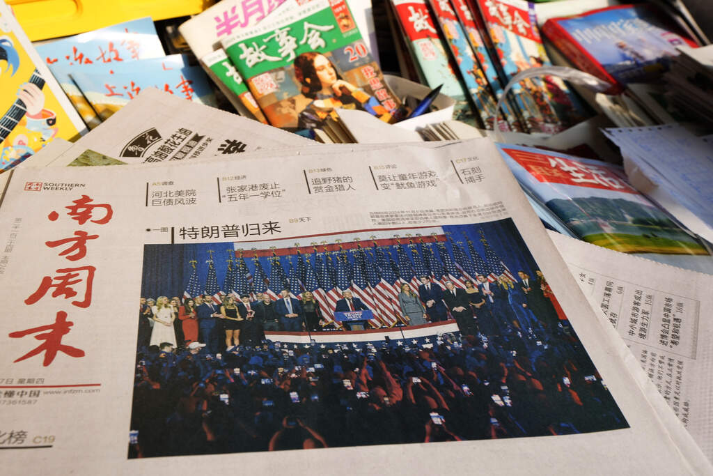 A front-page report on the U.S. election is seen at a news stand in Beijing, Thursday, Nov. 7, 2024. (AP Photo/Ng Han Guan)
